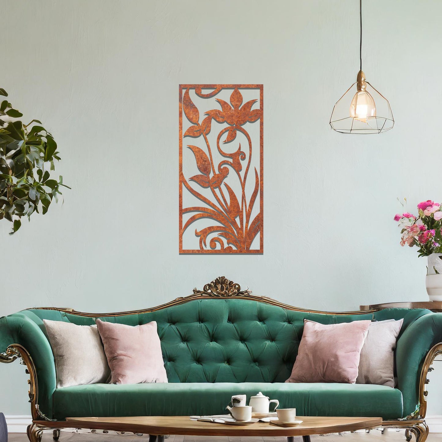 Metal wall art featuring a vertical design with elegant floral motifs and intricate swirling patterns, mounted on a neutral wall within sophisticated room decor. The delicate floral silhouette adds a refined and artistic touch to the space.