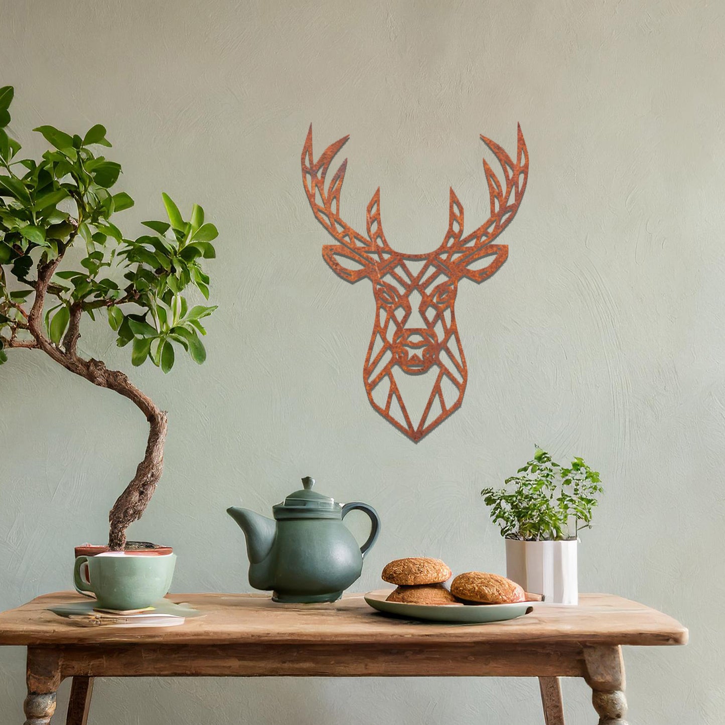 Metal wall art featuring a geometric deer head design with intricate detailing, crafted with precise laser-cut techniques, displayed on a neutral wall within modern decor.