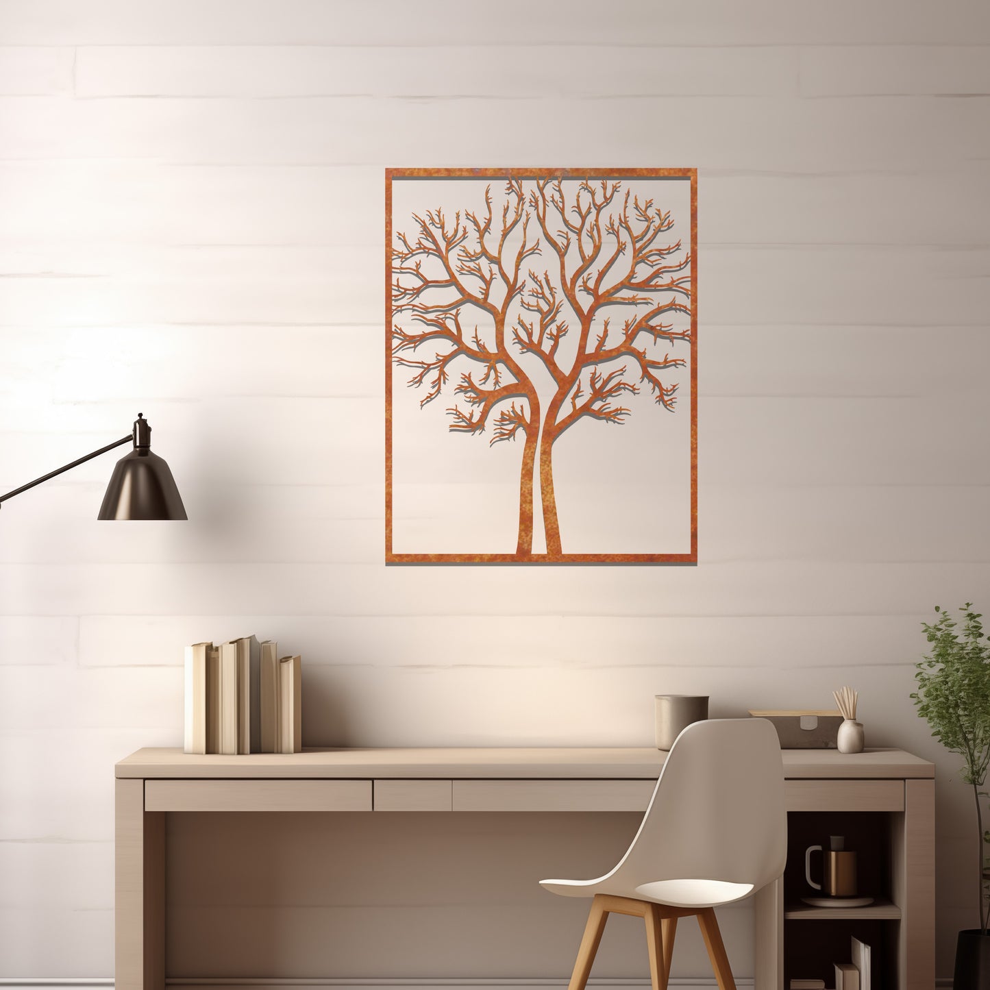 Metal wall art featuring a framed tree design with intricate, bare branches, crafted with precise laser-cut techniques, displayed on a neutral wall within modern decor.