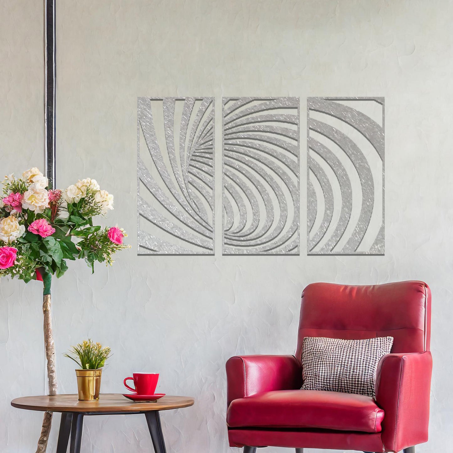 Metal wall art featuring a three-panel design with swirling, spiral-inspired patterns, crafted with precise laser-cut detailing, displayed on a neutral wall within modern decor.