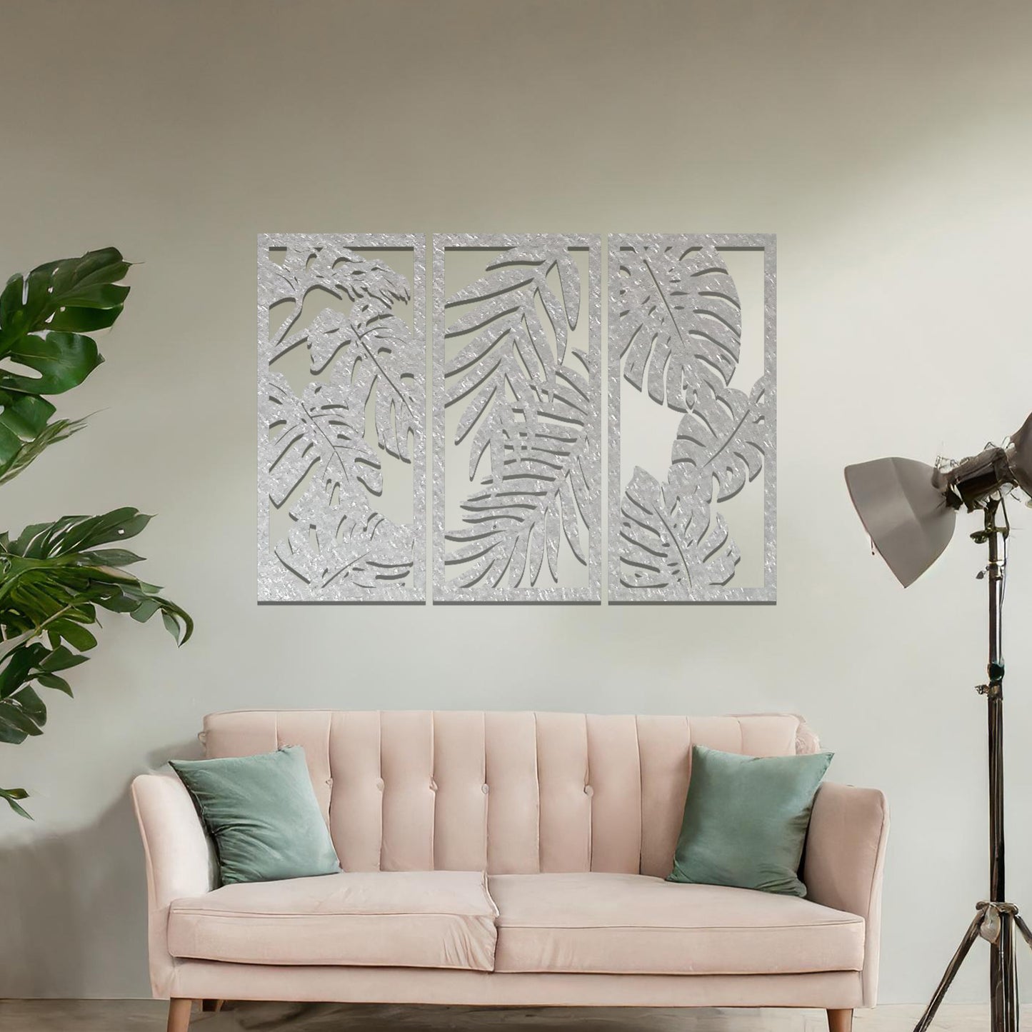 A tropical wall art set featuring a trio of panels adorned with intricate monstera and palm leaf patterns. Perfect for bringing a lush, botanical vibe to your indoor spaces.