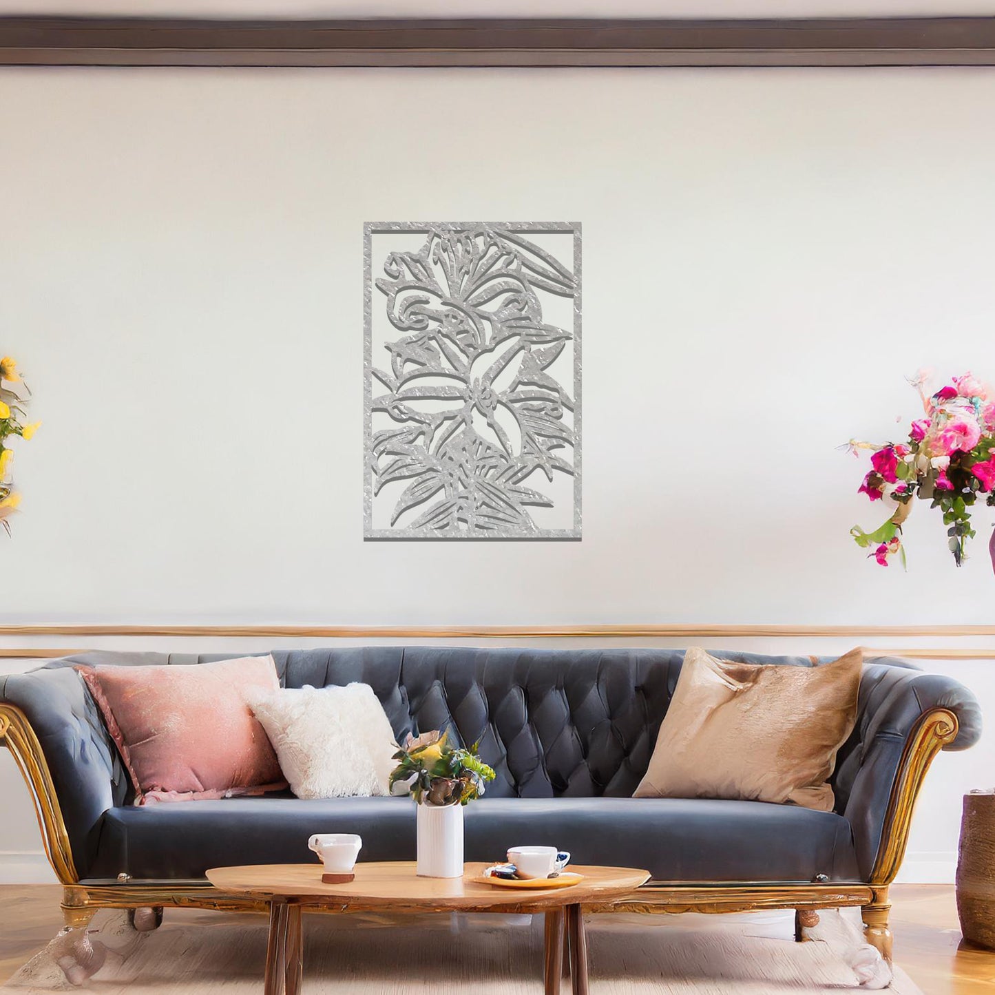 A metal wall art design showcasing a floral pattern with a large flower and leaves, set within a rectangular frame. The art is displayed on a neutral wall in a modern living room, adding an elegant and natural touch to the space.