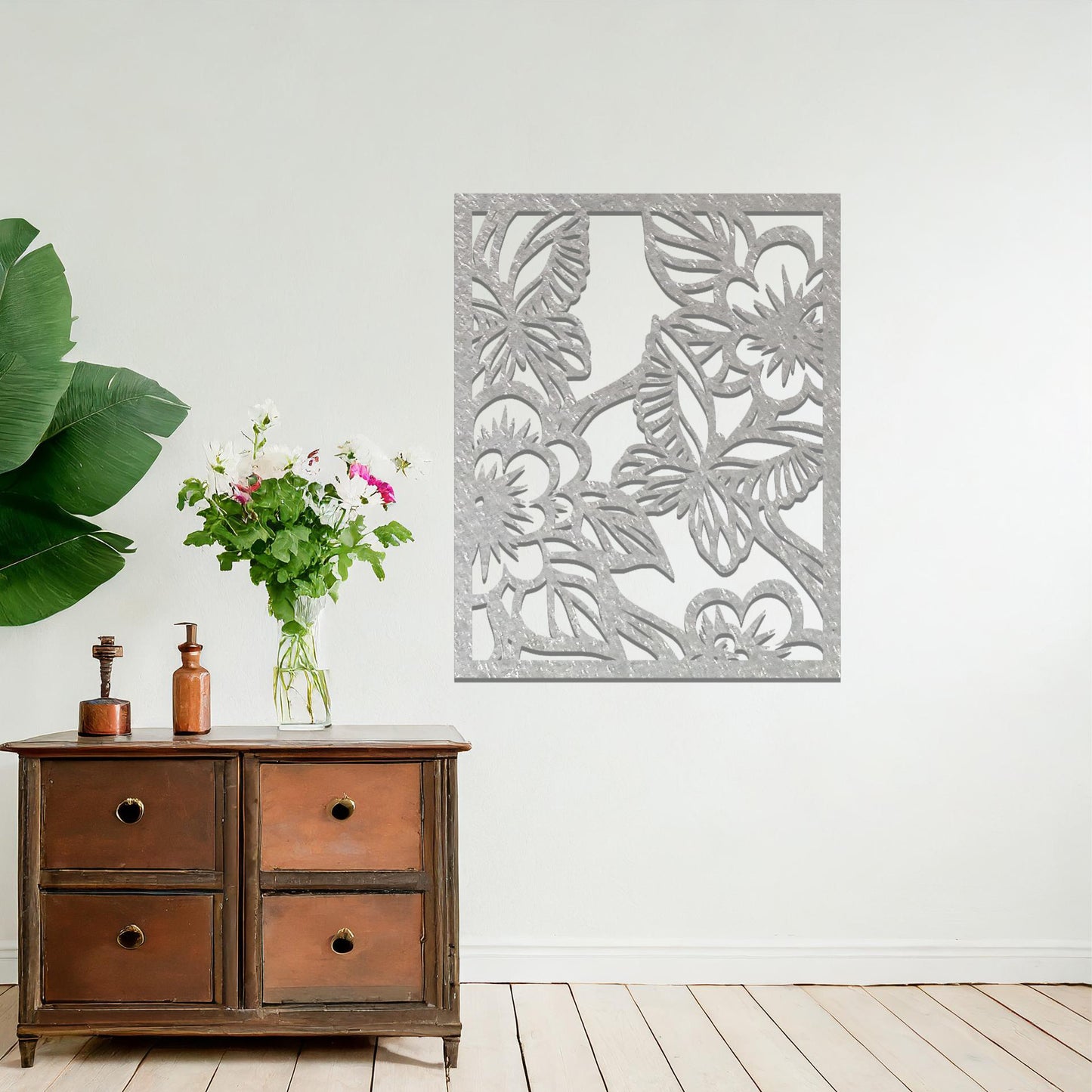 Metal wall art featuring a square design with a floral motif of blooming flowers and intricate leaves, mounted on a neutral wall within modern bedroom decor. The delicate detailing and natural theme create a soothing and elegant focal point, enhancing the space's aesthetic.