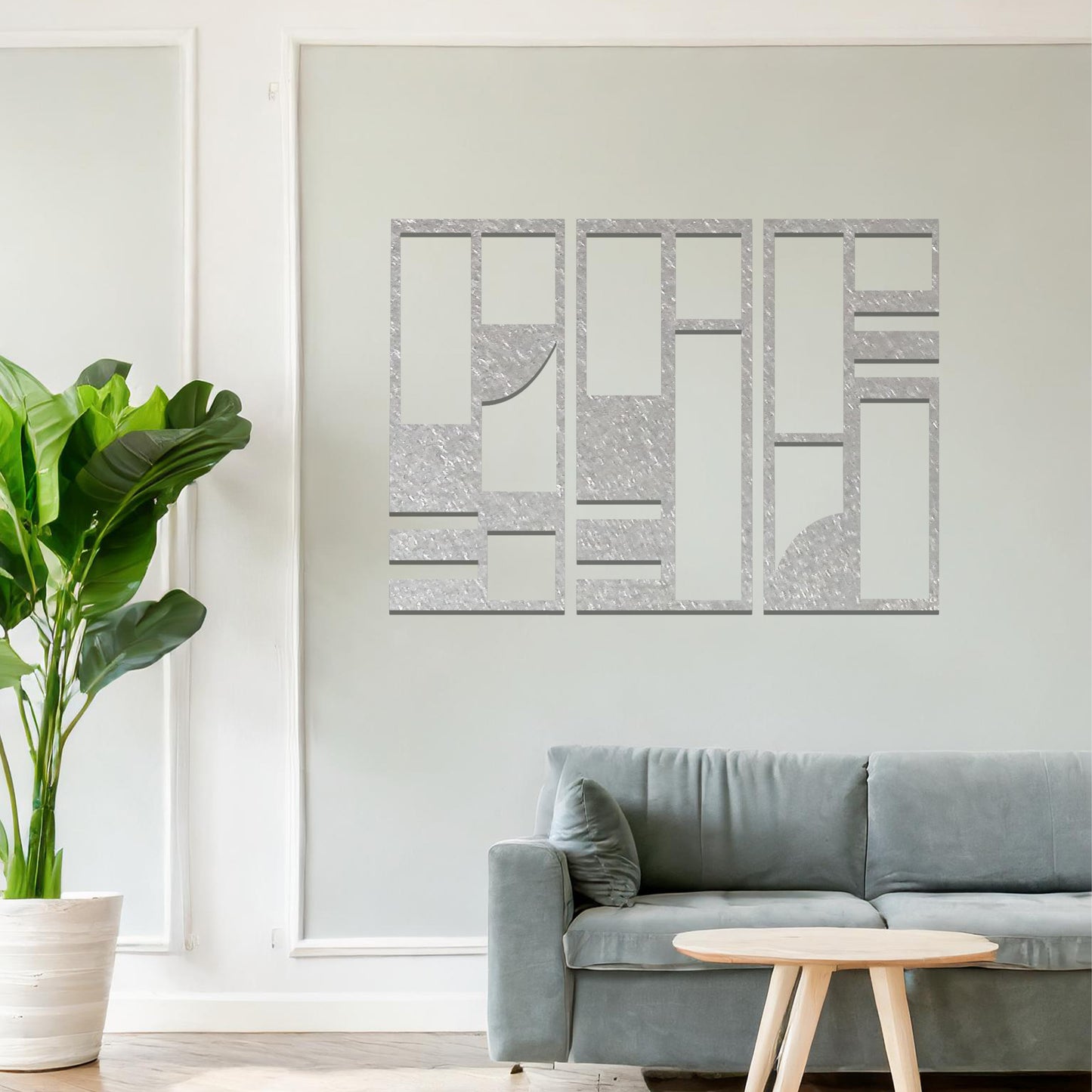 Abstract metal wall art set of three panels with geometric designs featuring rectangular and square shapes, curved lines, and clean angles. The art is displayed on a neutral wall within modern room decor, adding a contemporary touch to the space.