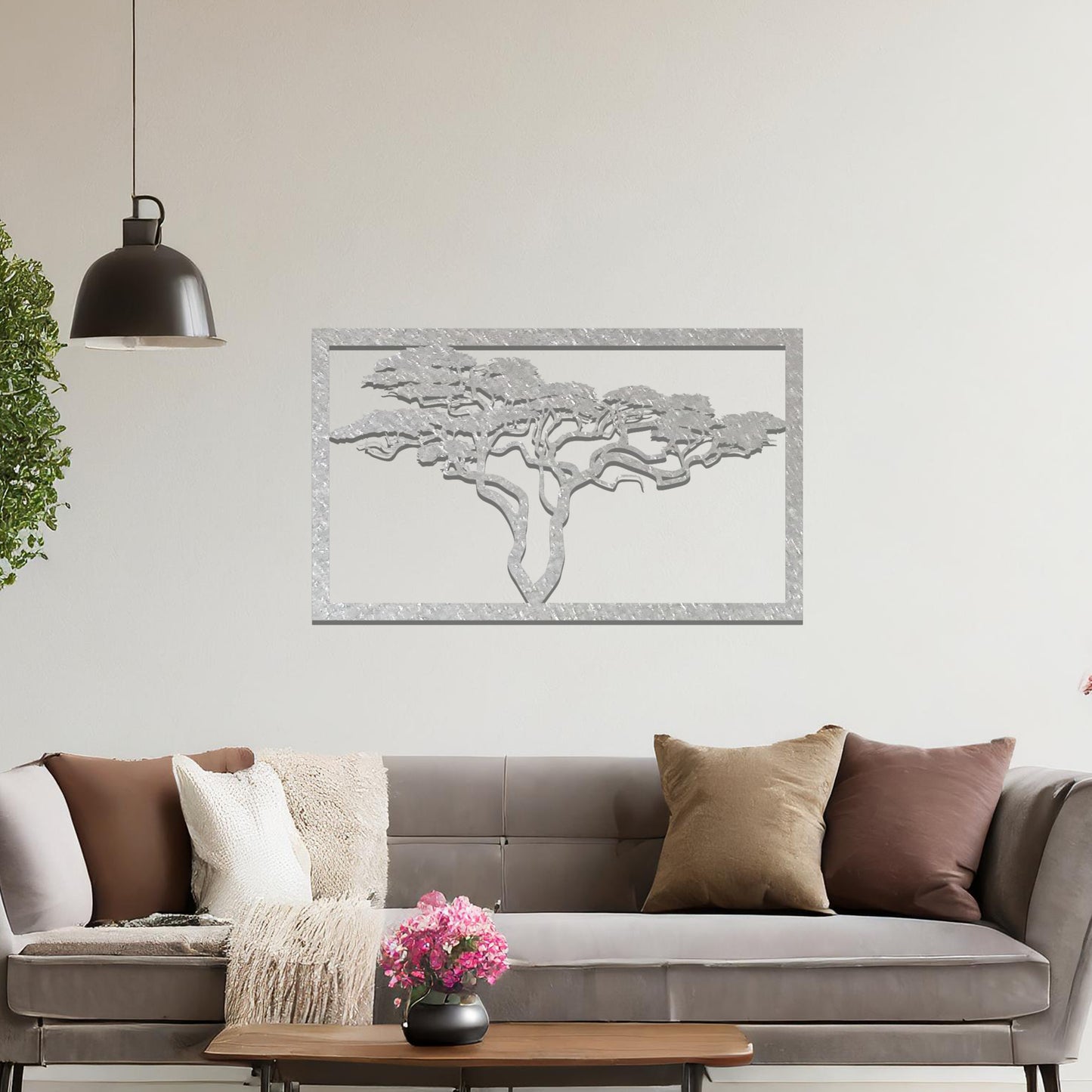 Metal wall art featuring a rectangular design with a silhouette of an African tree, showcasing intricate branch details, mounted on a neutral wall within modern office decor. The elegant craftsmanship adds a natural and sophisticated touch to the contemporary workspace.