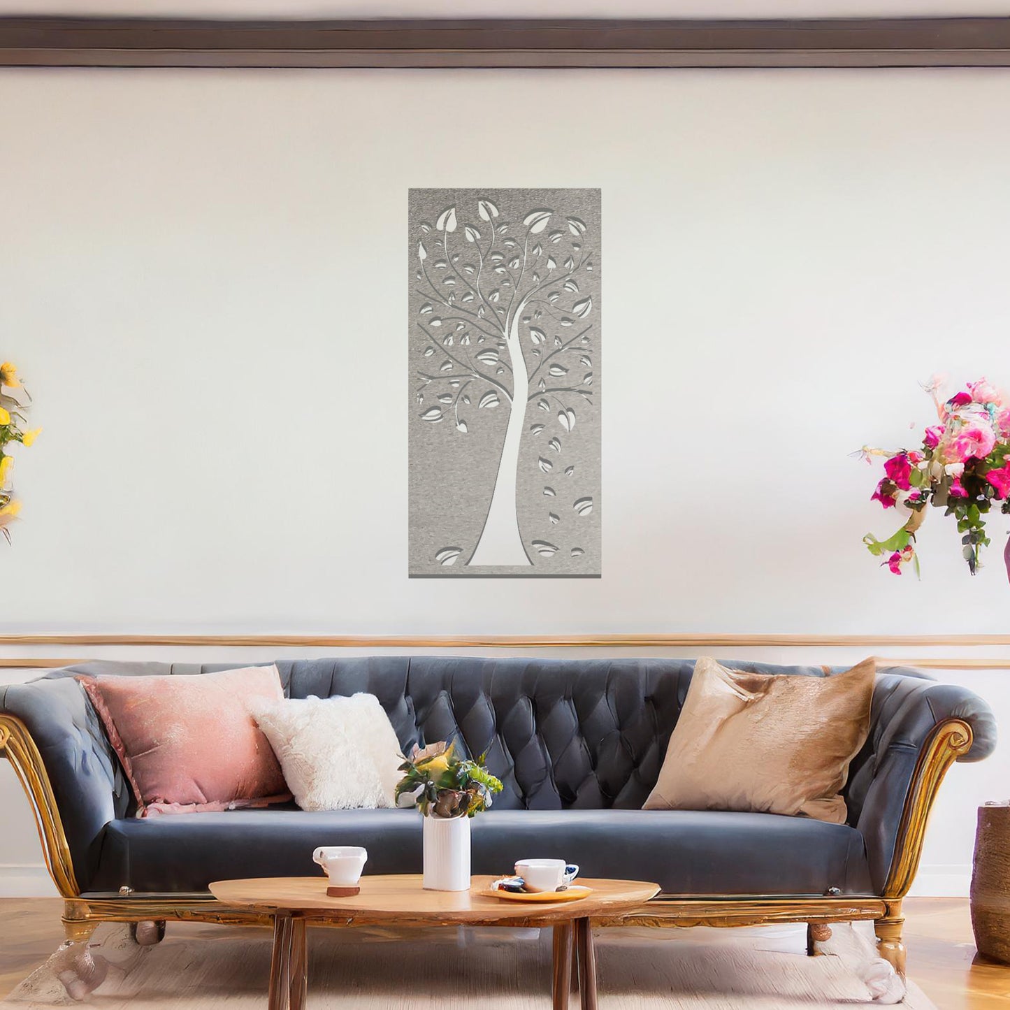 Metal wall art featuring a tree with intricate branches and leaves, enclosed in a vertical rectangular frame. The artwork is displayed on a neutral wall within a modern office setting, complemented by a desk, chair, and indoor plants.