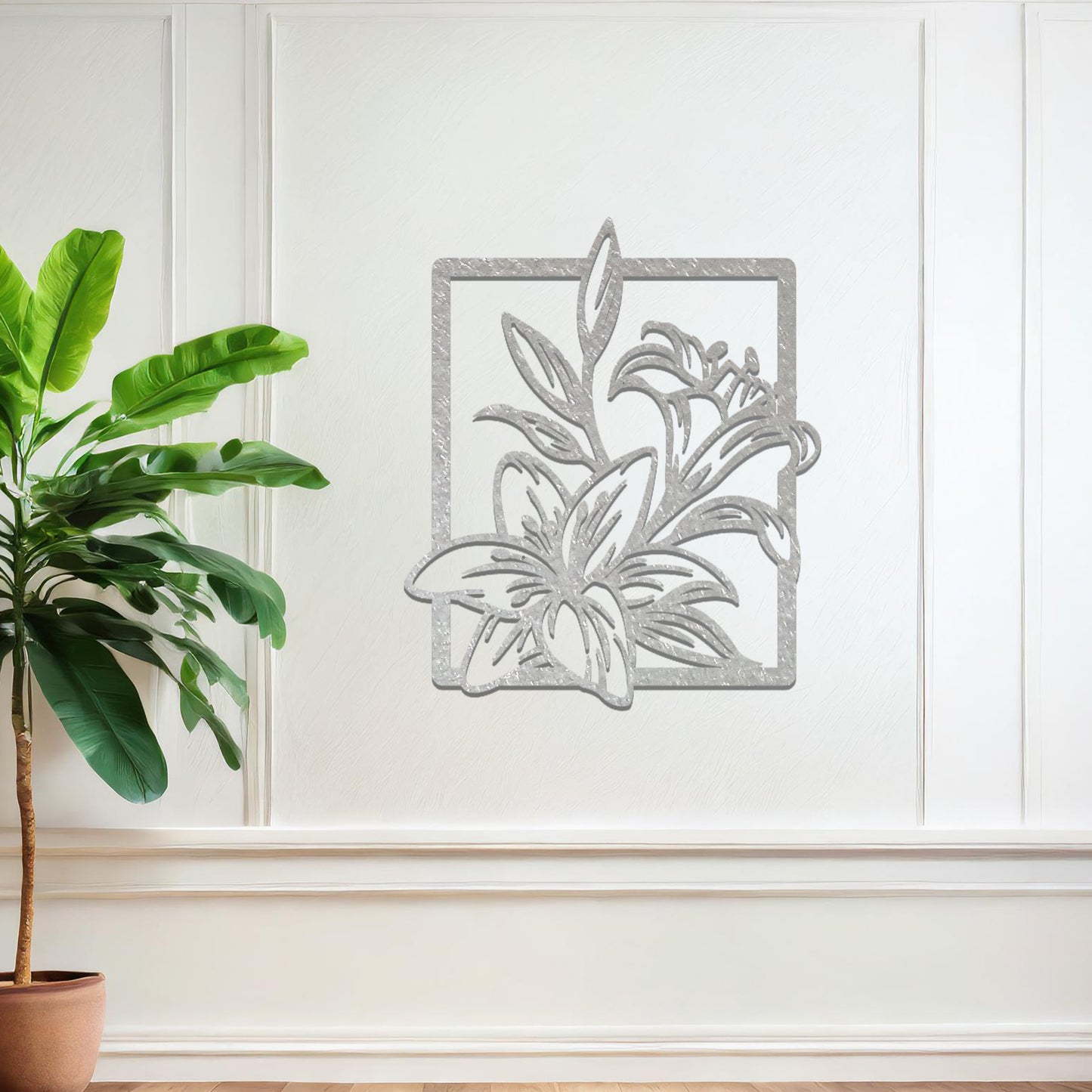 Metal wall art featuring a rectangular design with elegant floral motifs, including detailed lilies and leaves, adding a touch of sophistication and natural beauty to the space.