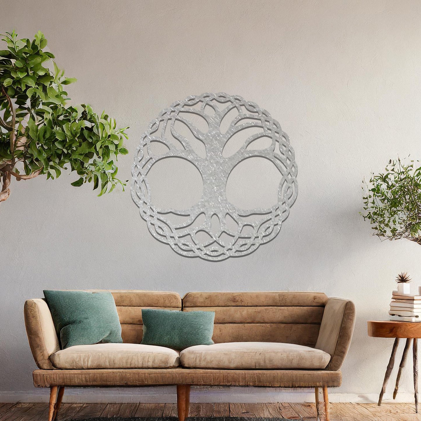 Metal wall art featuring a circular tree of life design with intricately interwoven branches and roots, creating a harmonious and symbolic focal point for the room.