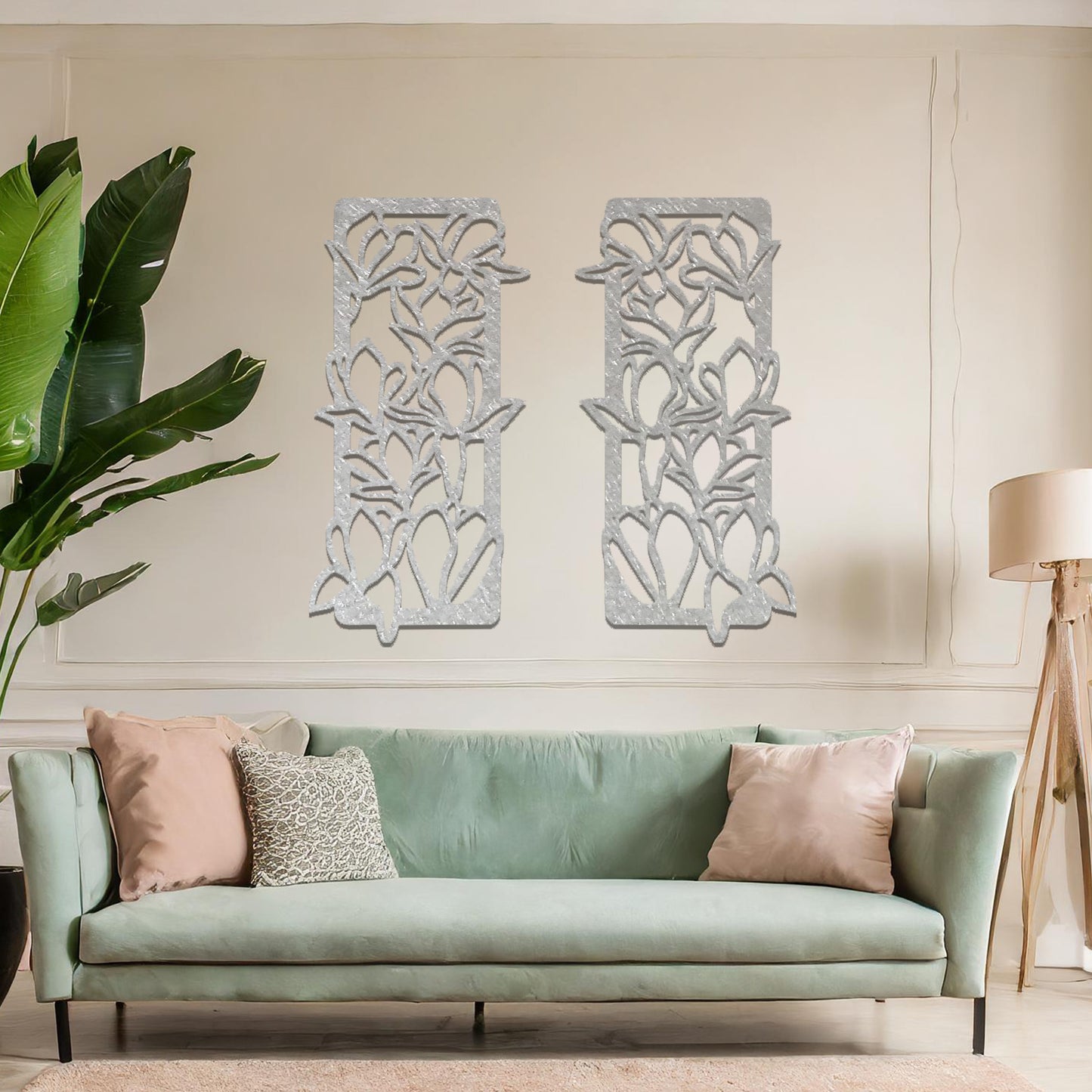Metal wall art featuring a pair of vertical panels with floral-inspired designs of intertwined stems and leaves, crafted with precise laser-cut detailing, displayed on a neutral wall within modern decor.