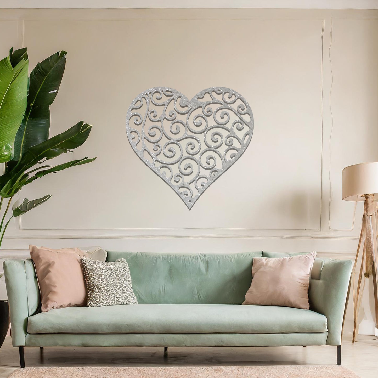 Metal wall art featuring a heart-shaped design with intricate swirling patterns, adding an elegant and romantic touch to the room’s decor.