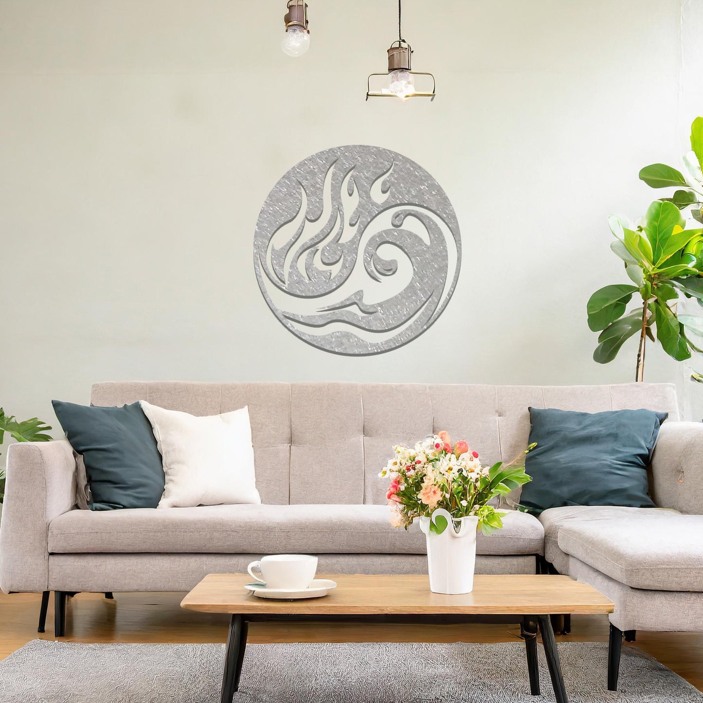 Metal wall art featuring a circular design with a dynamic swirl of flames and waves, mounted on a neutral wall within modern decor. The fluid lines and bold elements create a striking and energetic focal point for the room.