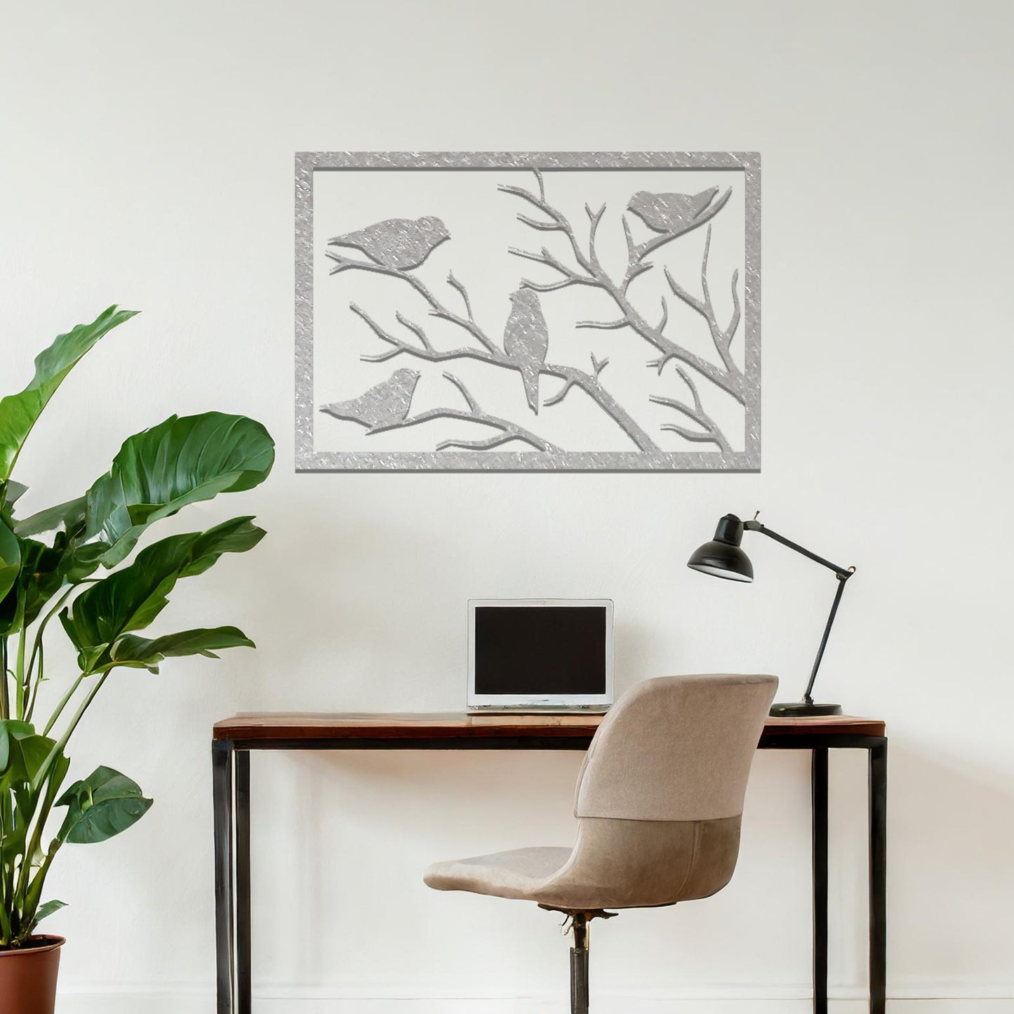 Metal wall art featuring a rectangular design of birds perched on bare branches, showcasing intricate silhouettes and adding a touch of nature-inspired charm to the interior space.