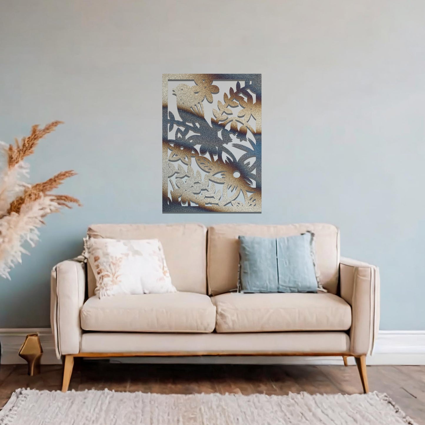 Metal wall art featuring a rectangular design with a bird perched amidst detailed floral and leafy patterns, mounted on a neutral wall within modern room decor. The intricate details and natural elements create a lively and elegant focal point.