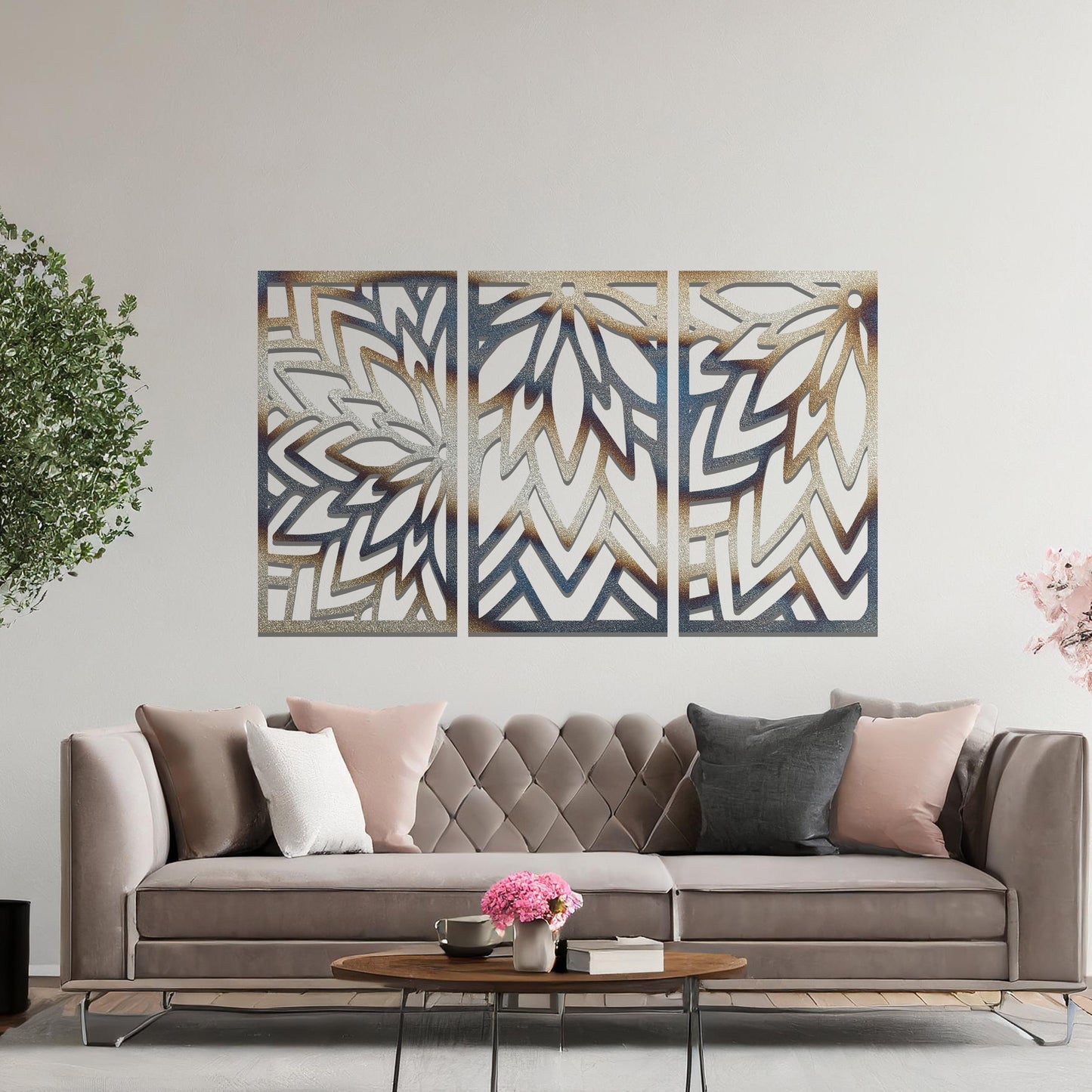 Metal wall art featuring a three-panel design with floral-inspired geometric patterns, crafted with precise laser-cut detailing, displayed on a neutral wall within modern decor.