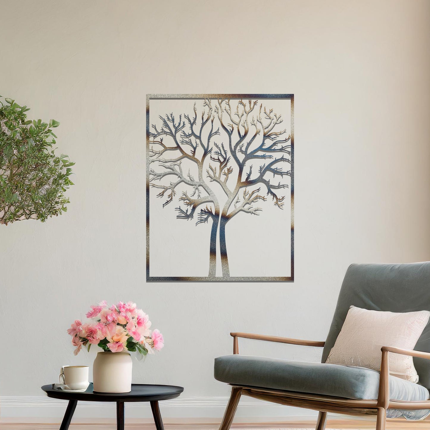 Metal wall art featuring a framed tree design with intricate, bare branches, crafted with precise laser-cut techniques, displayed on a neutral wall within modern decor.