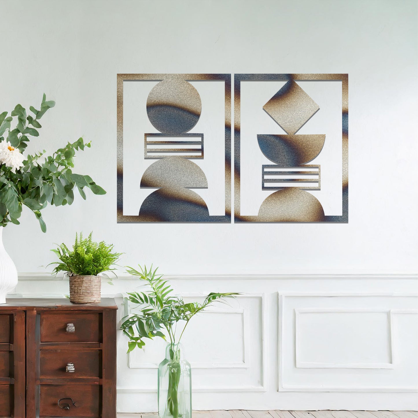 A metal wall art set featuring geometric shapes, including circles and a diamond, arranged in a balanced and symmetrical design. The art is displayed on a neutral wall within modern room decor, adding an elegant and abstract touch to the space.