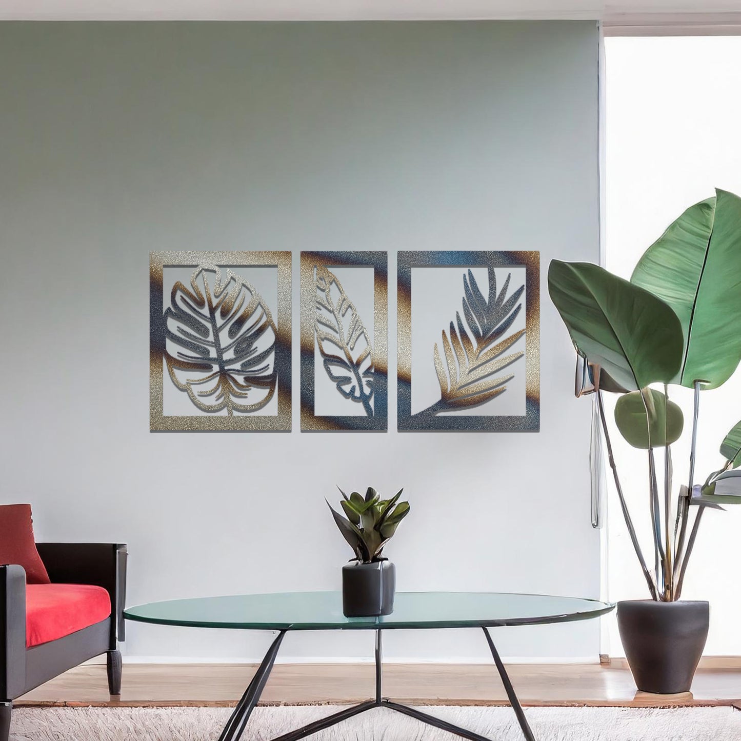 Metal wall art featuring a three-panel design with detailed leaf patterns, mounted on a neutral wall within modern decor. The organic motifs and rust finish create a natural, earthy focal point, enhancing the room's aesthetic.