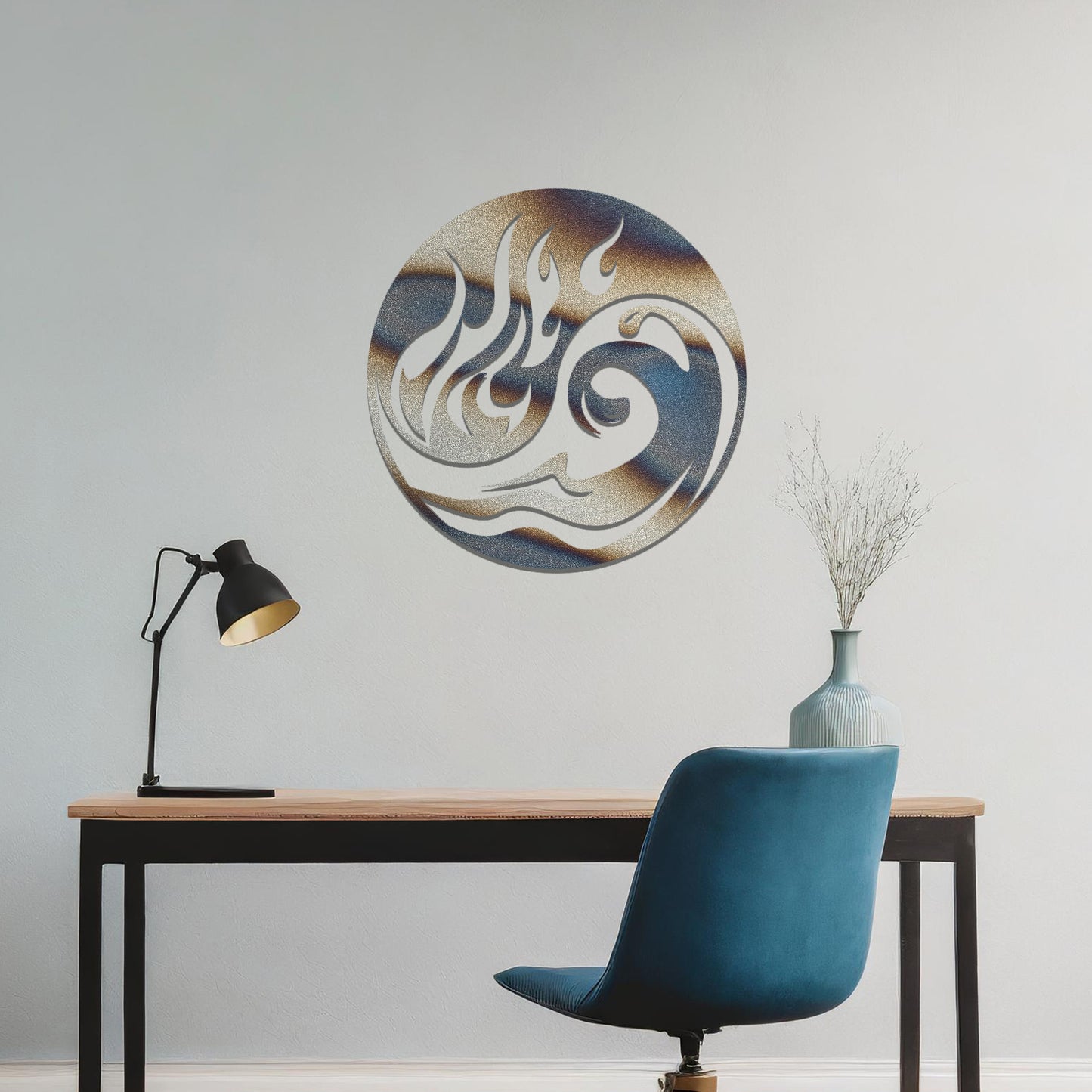 Metal wall art featuring a circular design with a dynamic swirl of flames and waves, mounted on a neutral wall within modern decor. The fluid lines and bold elements create a striking and energetic focal point for the room.