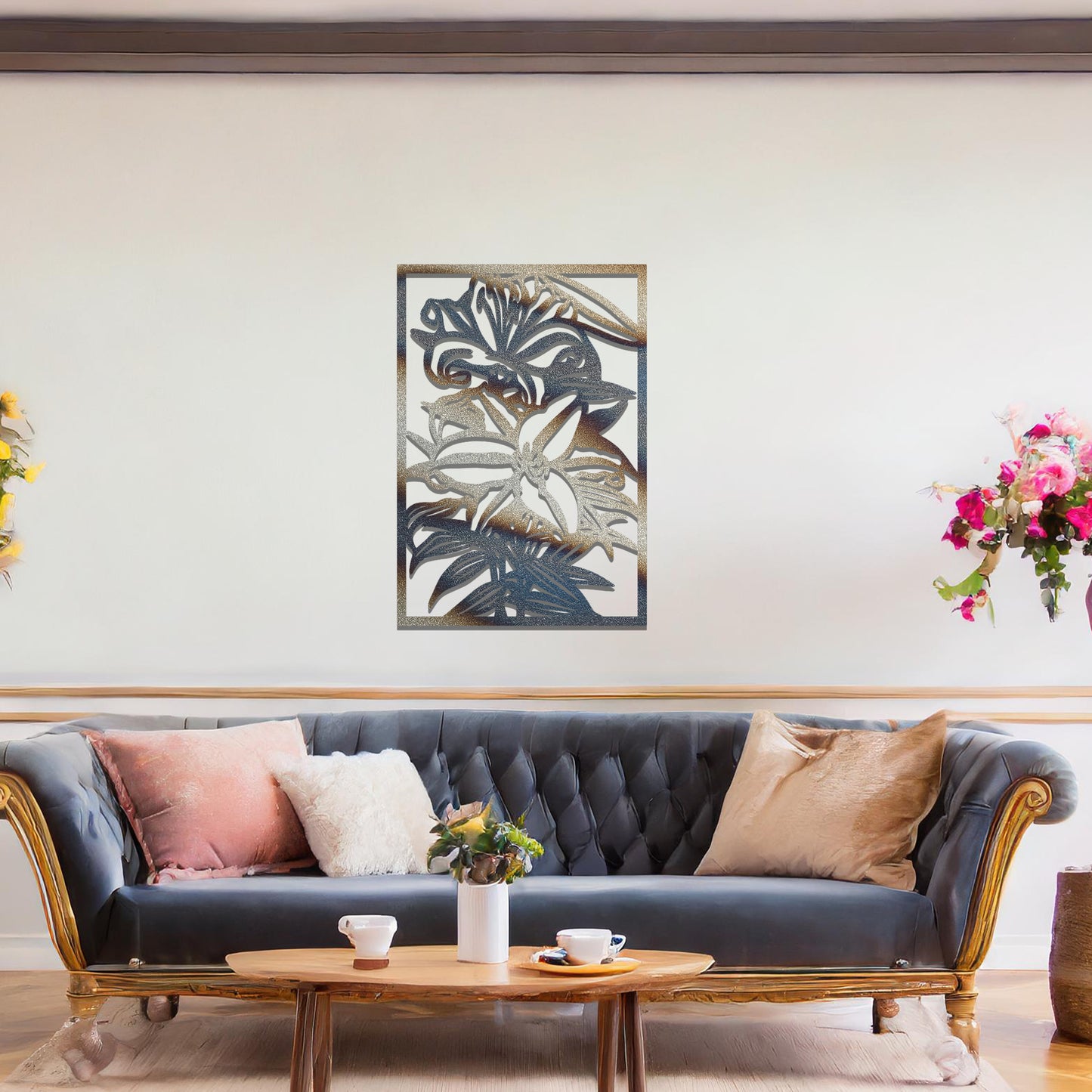 A metal wall art design showcasing a floral pattern with a large flower and leaves, set within a rectangular frame. The art is displayed on a neutral wall in a modern living room, adding an elegant and natural touch to the space.