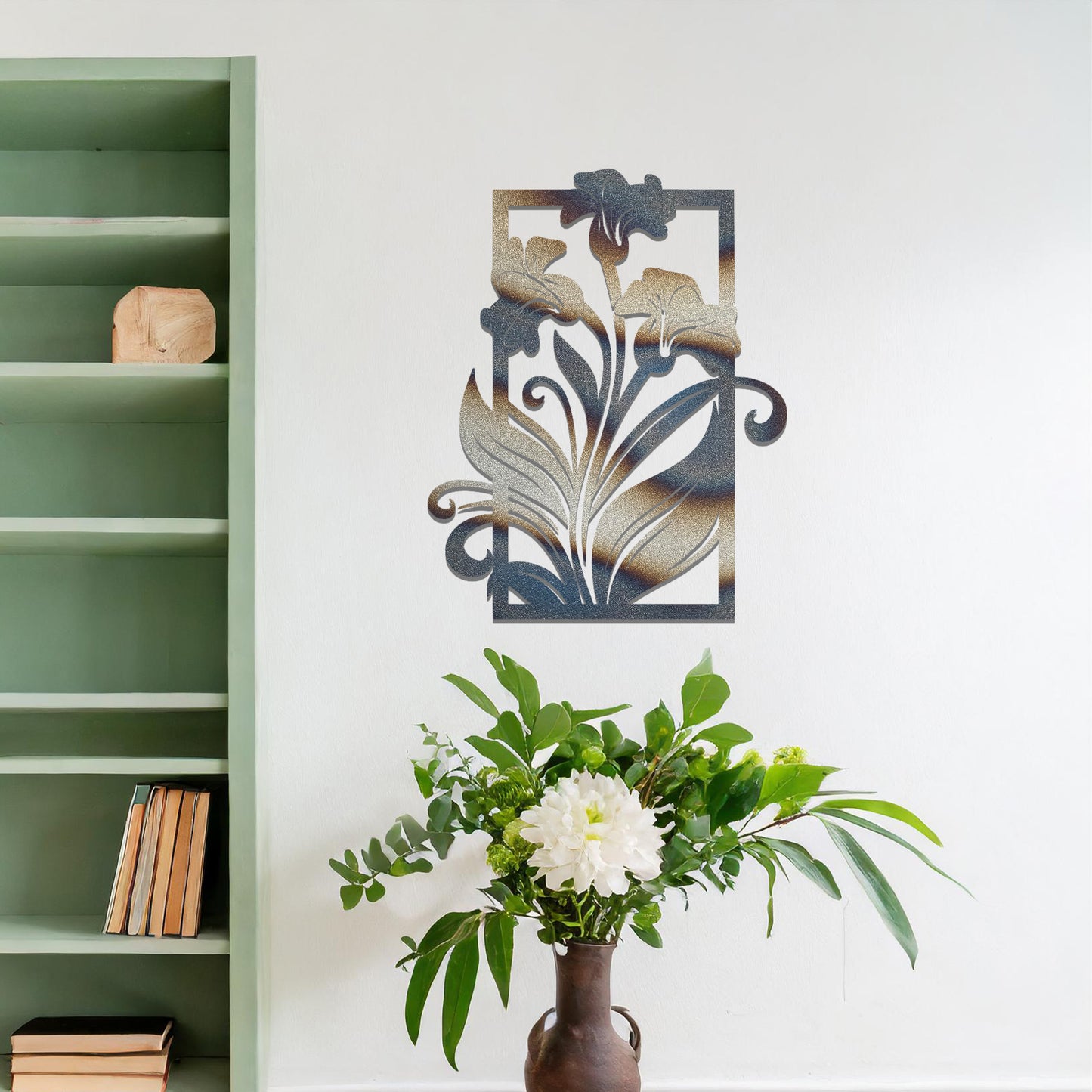 A metal wall art design featuring a graceful floral arrangement with flowers and curving leaves within a rectangular frame. The art is displayed on a neutral wall in a modern living room, enhancing the space with a touch of elegance and nature.