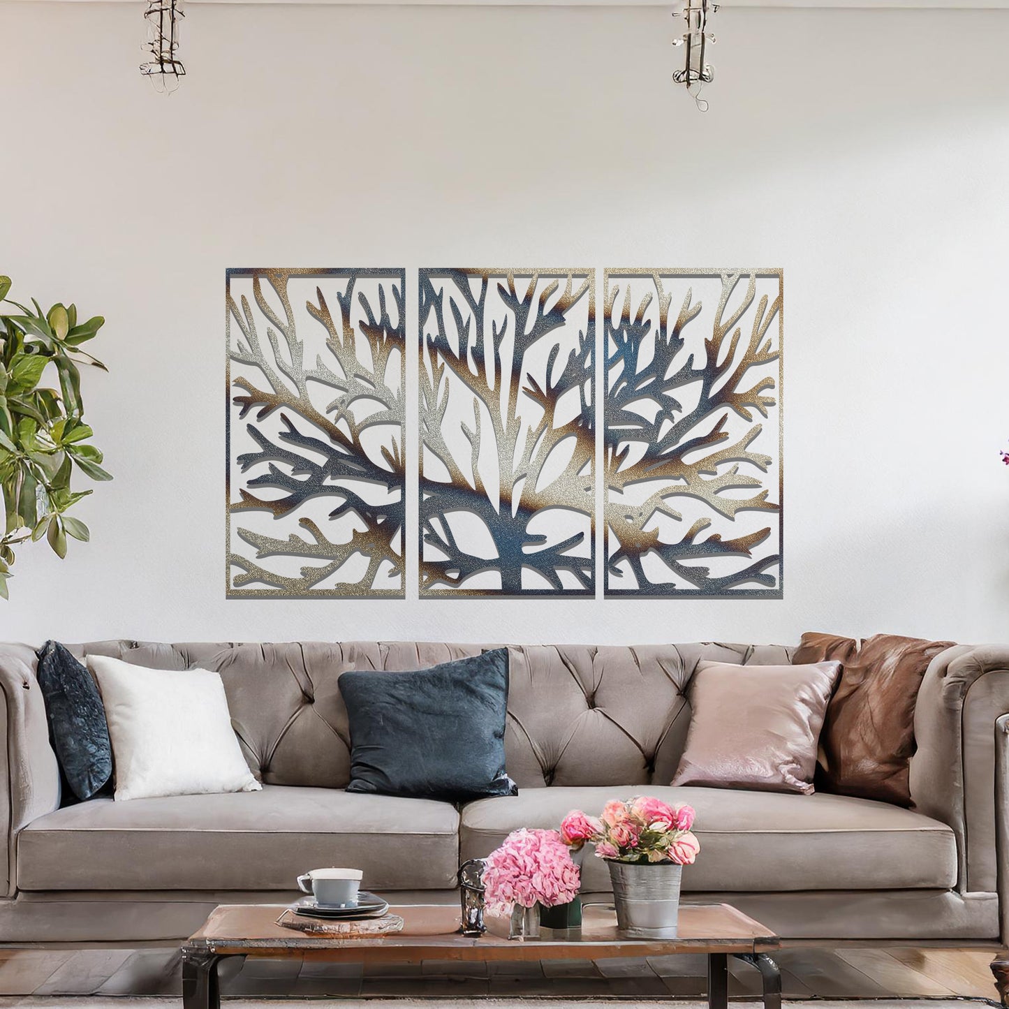 Metal wall art design featuring a stylized tree with intricate branches, presented in a triptych layout. The design captures detailed, organic lines forming the tree’s structure, emphasizing the natural flow and texture of the branches. The art is displayed on a neutral wall.