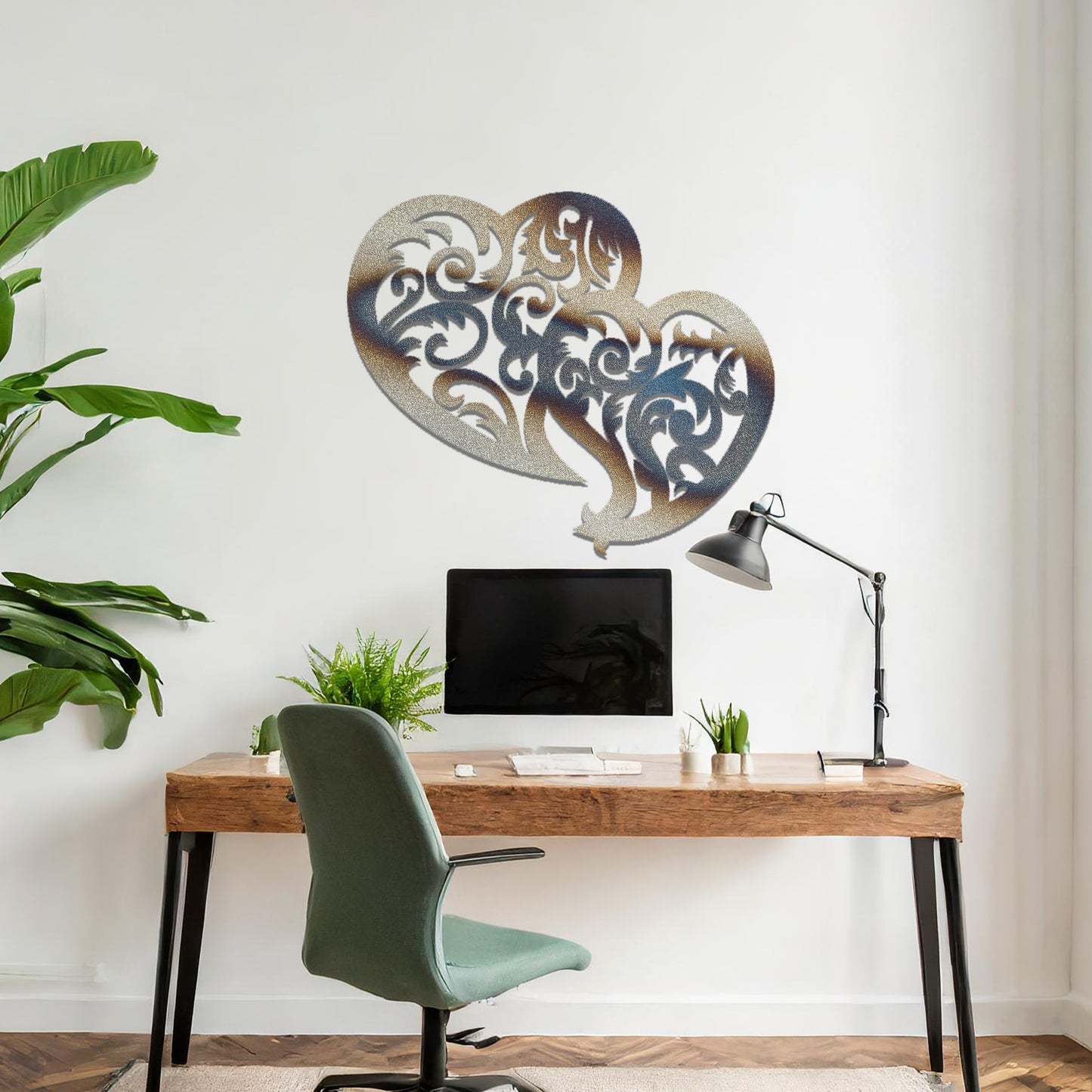 Metal wall art featuring a pair of intricately designed hearts with swirling patterns, mounted on a neutral wall within modern room decor. The elegant detailing creates a romantic and artistic focal point, adding a touch of love to the space.