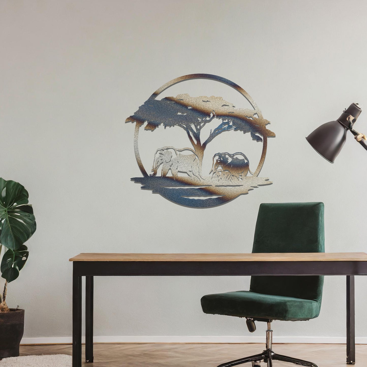 Metal wall art featuring a design of two elephants beneath a tree, framed in a circular shape. The art is placed on a neutral wall within modern room decor, creating a serene and nature-inspired atmosphere.