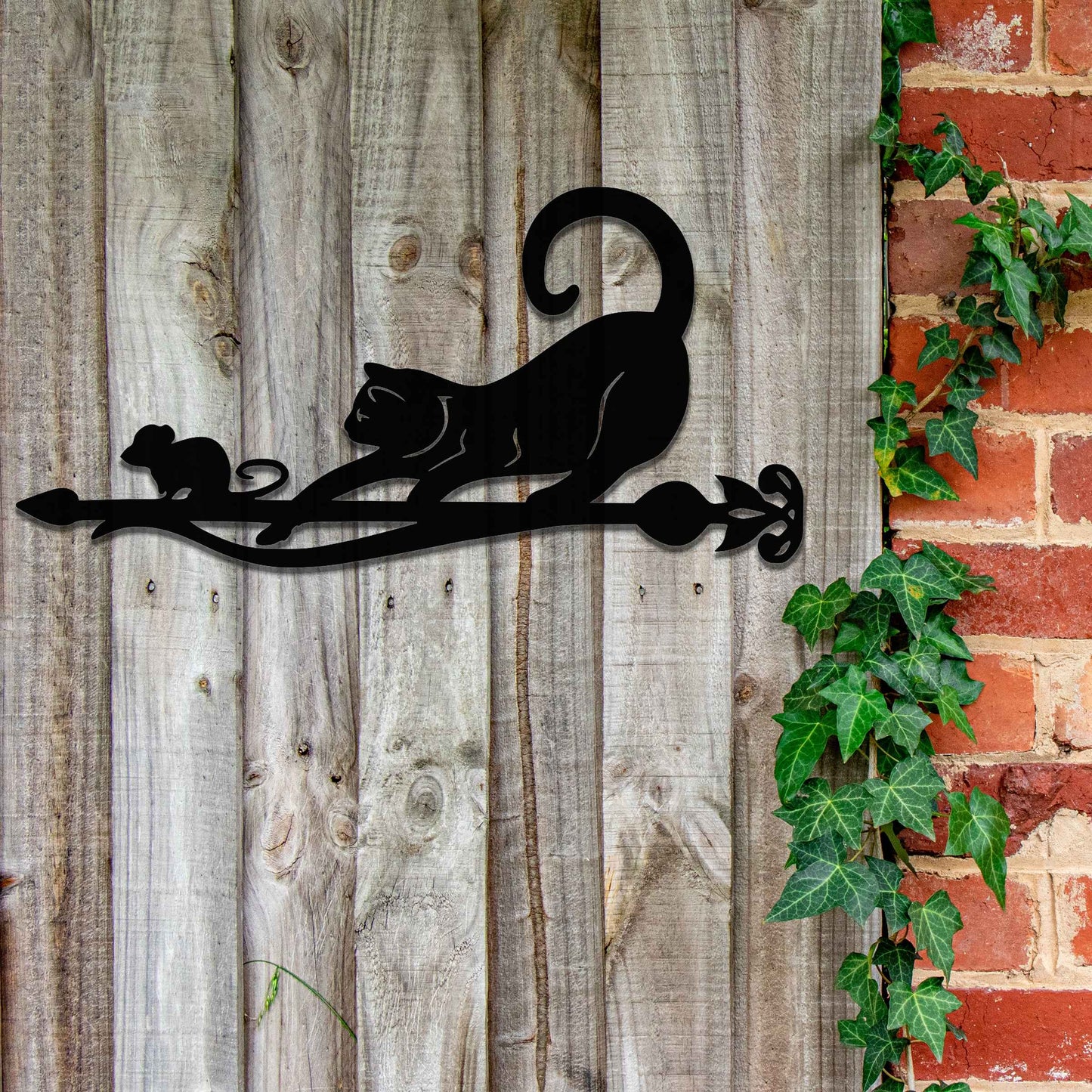 Metal garden decoration featuring a playful cat and mouse silhouette on a decorative branch, crafted with intricate details and a rustic finish, adding a whimsical and charming touch to outdoor spaces.