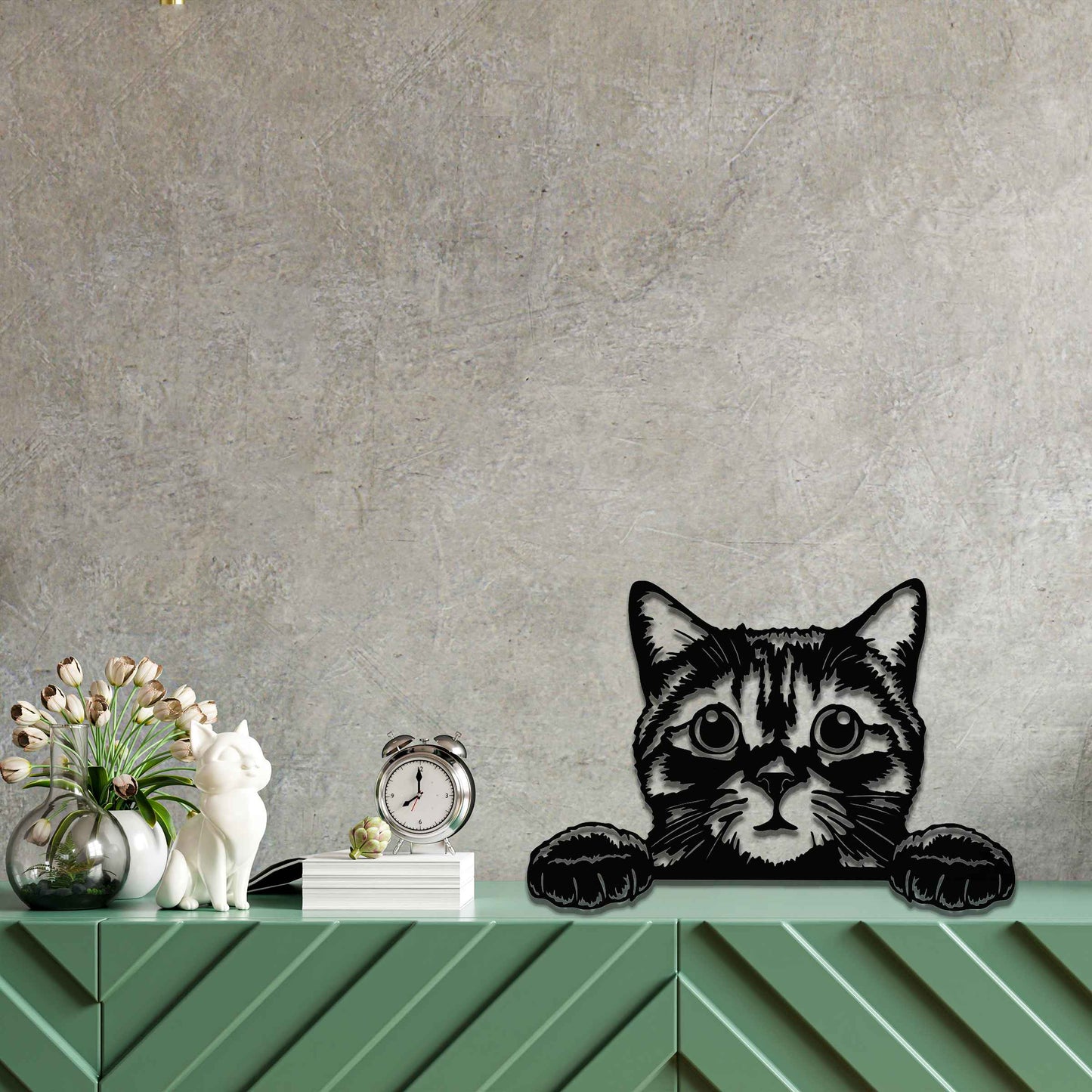 A charming metal wall art piece featuring an adorable cat peeking over a surface, its wide eyes and paws reaching out, adding a playful and endearing touch to modern home decor.