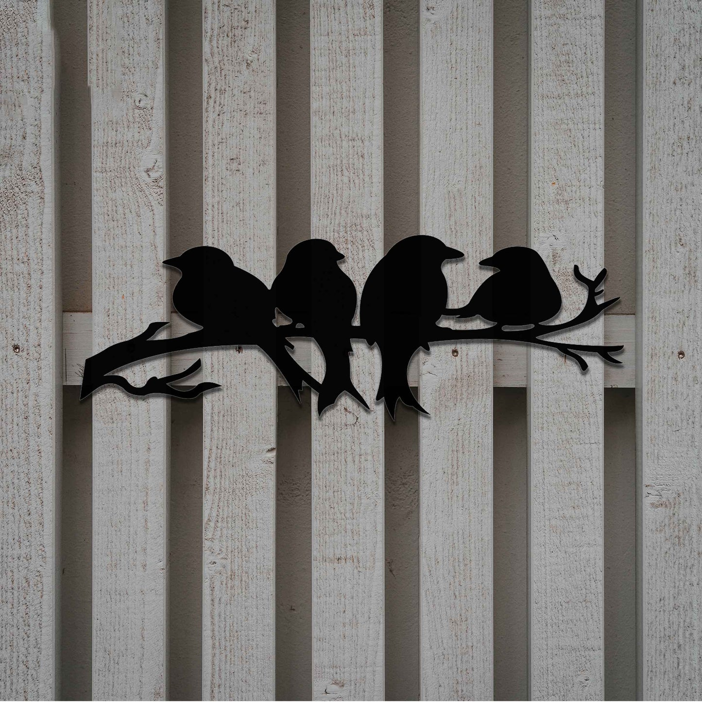 Metal garden decoration featuring four birds sitting on a branch, crafted with intricate cutout details and a rustic finish, adding a delightful and natural charm to outdoor walls or garden spaces.