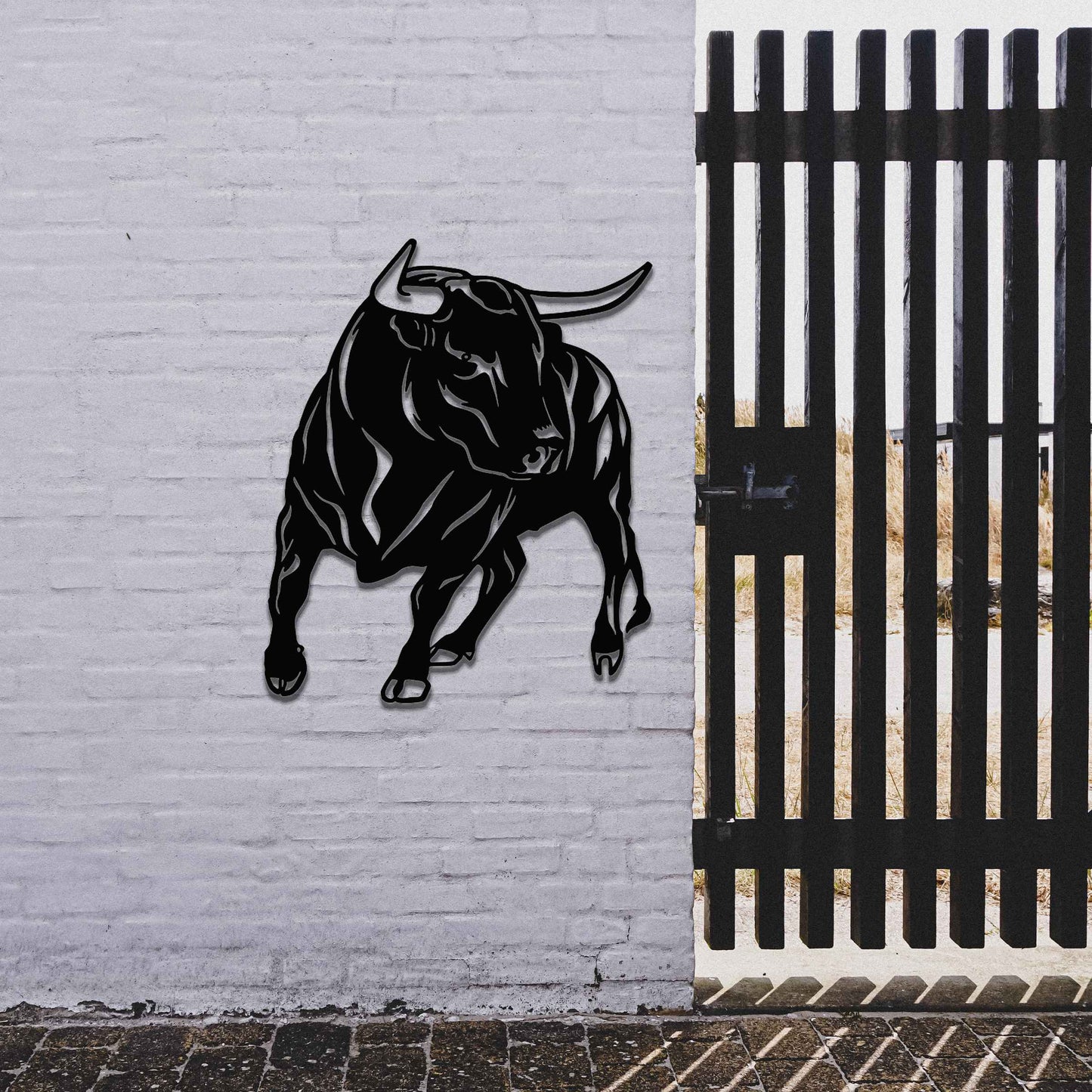 The design features a dynamic bull captured in a strong and assertive pose, showcasing its muscular build. The bull’s stance emphasizes power and movement, conveying a sense of energy and resilience.