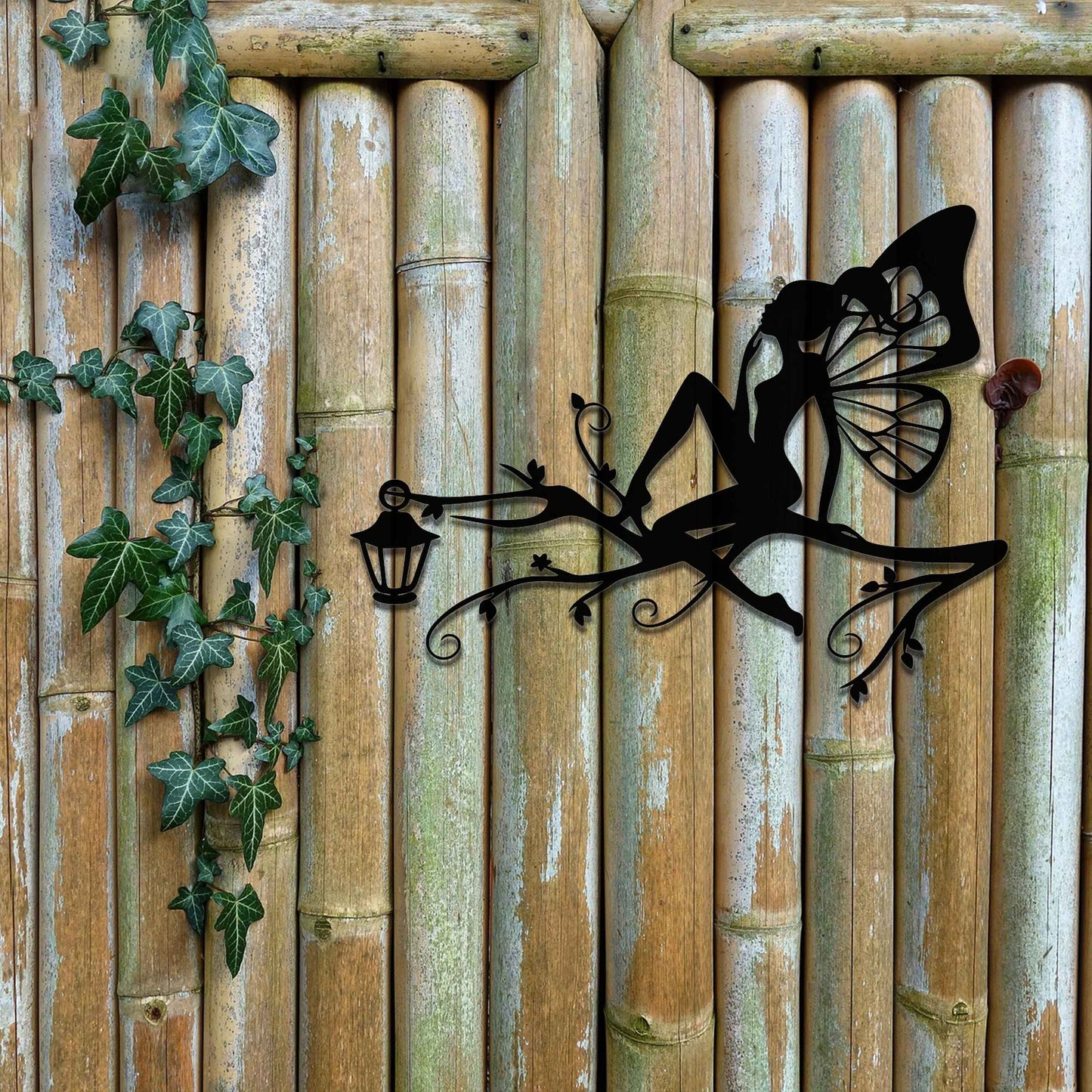 This design features a fairy seated elegantly on a tree branch with intricate vines, accompanied by a charming lantern. The detailed wings and graceful pose of the fairy add a magical, whimsical touch to the piece.