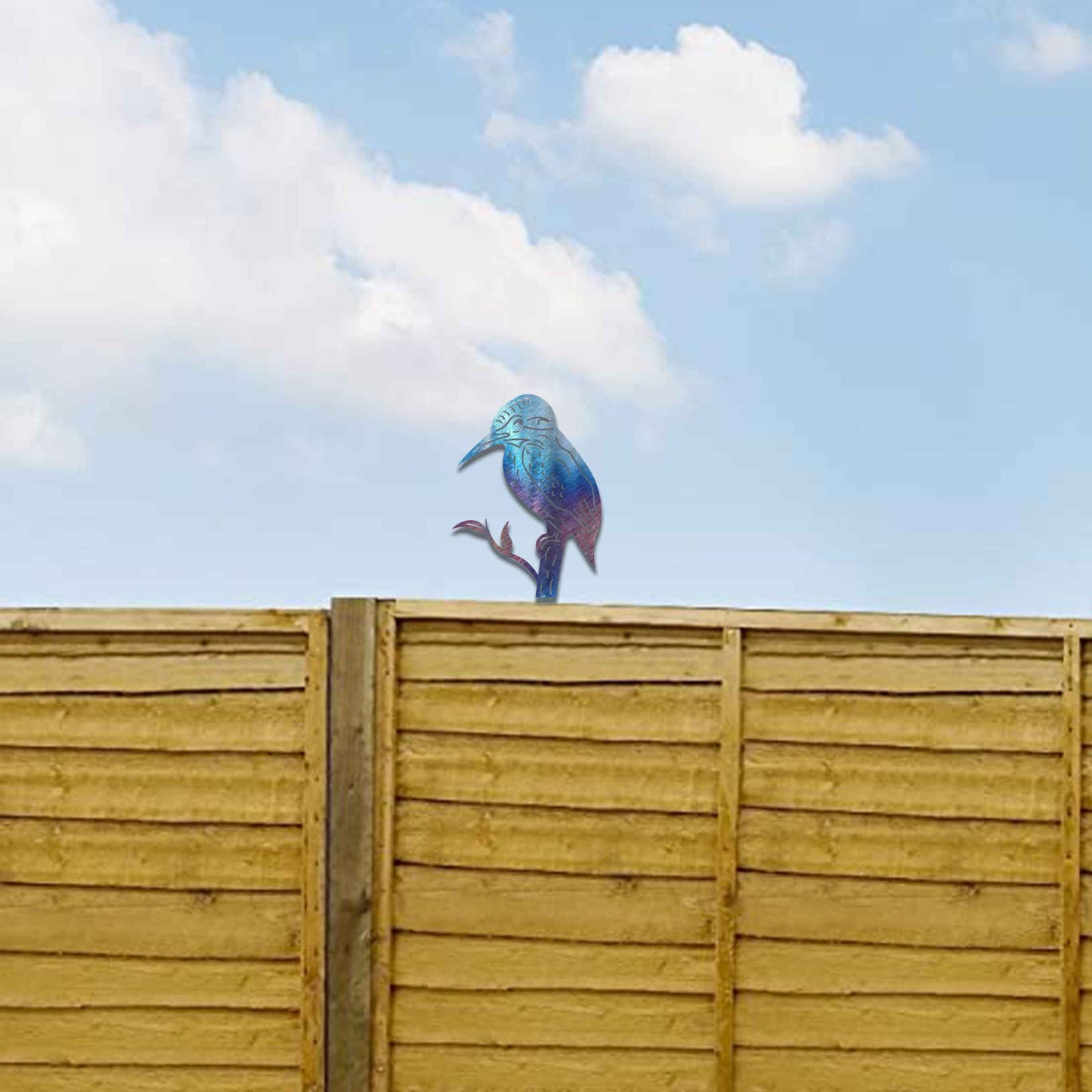 Metal garden decoration featuring a kingfisher silhouette perched on a branch, crafted with a rustic finish, designed to sit atop fences or garden posts, adding a natural and artistic accent to outdoor spaces.
