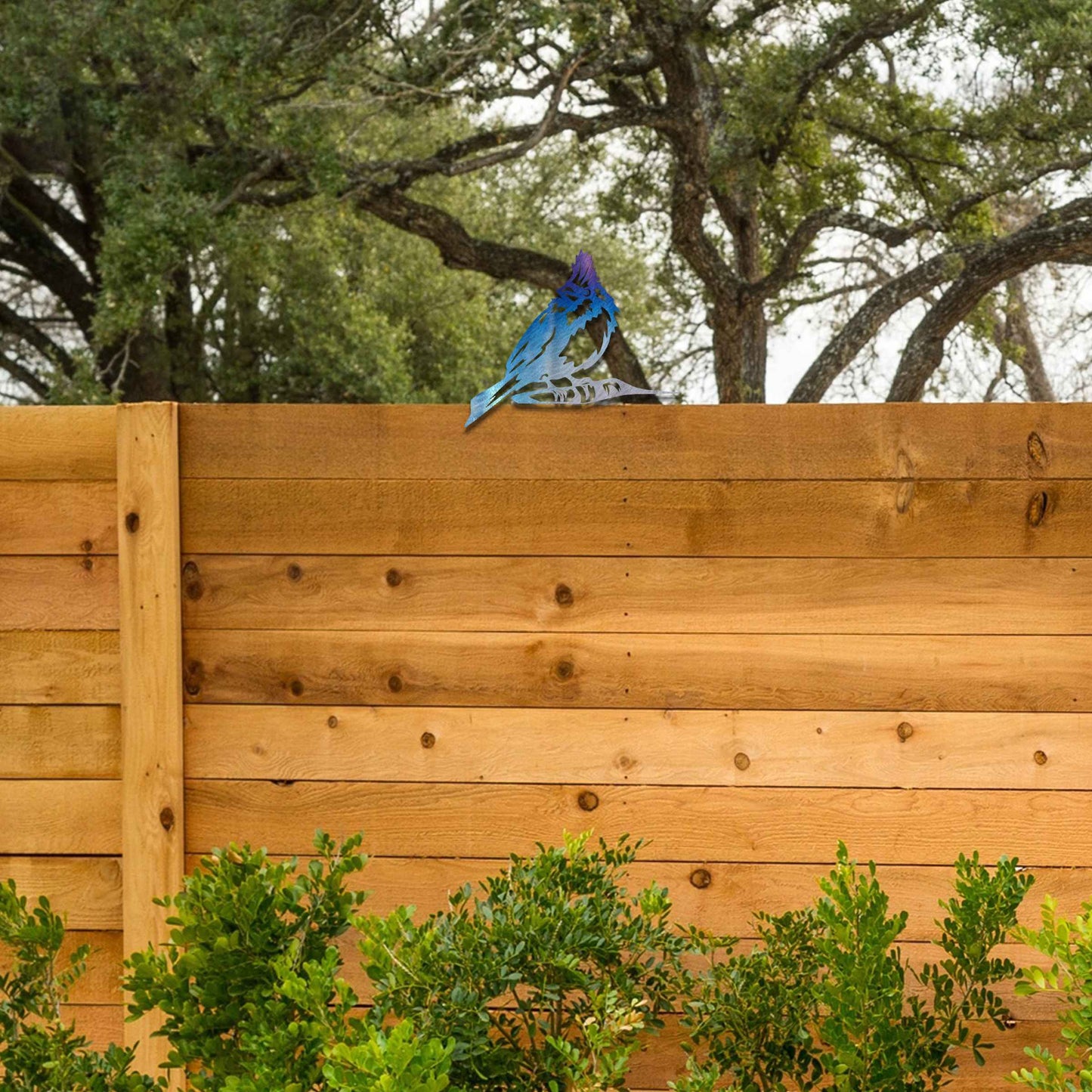 Metal garden decoration featuring a hoopoe bird silhouette with intricate cutout details and a rustic finish, designed to sit atop fences or posts, adding a distinctive and elegant touch to outdoor spaces.