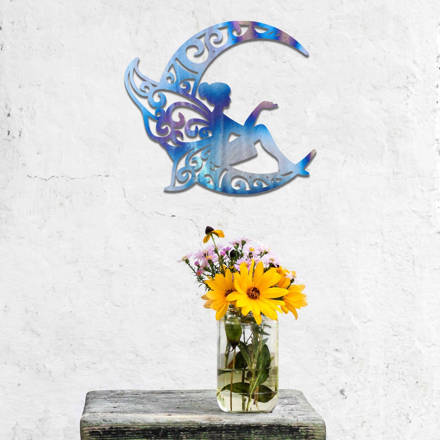 This design features a fairy seated gracefully on a crescent moon, with intricate, swirling patterns on the moon and the fairy’s wings. The detailed curves and flowing lines of the design create a whimsical, peaceful atmosphere, perfect for adding a touch of magic to any room.