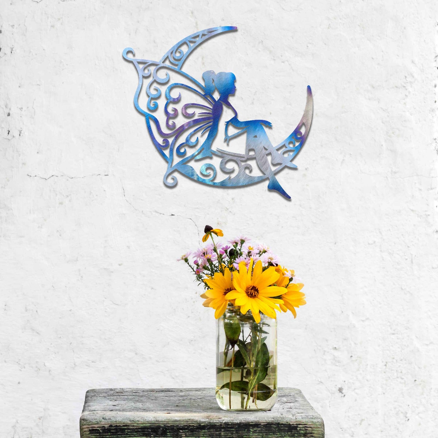 This design shows a fairy sitting on a crescent moon, with elegantly detailed, swirling patterns adorning both the moon and her wings. The graceful pose of the fairy and the intricate designs create a dreamy and whimsical atmosphere, perfect for adding a touch of magic to any space.