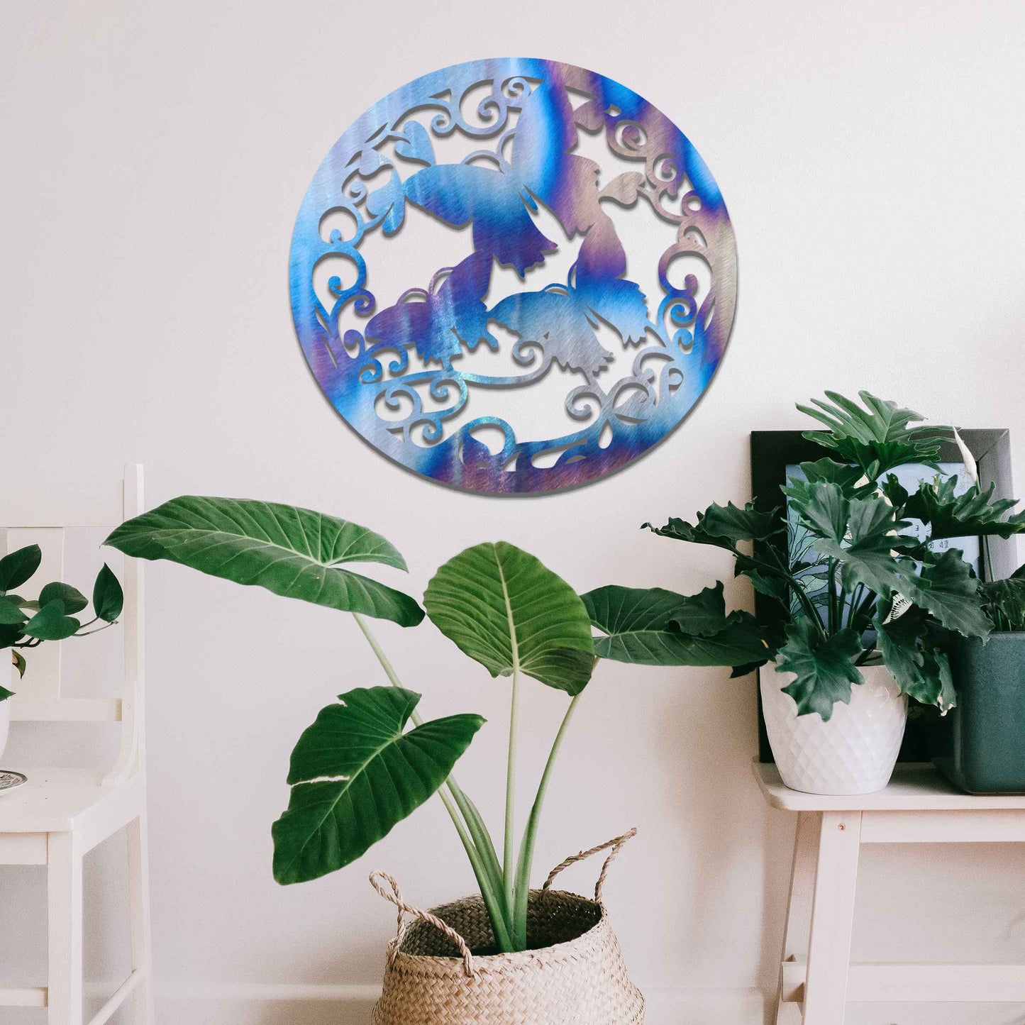 Metal garden decoration featuring a circular design with intricate butterflies and swirling vine patterns, adding a touch of elegance and nature-inspired artistry to outdoor or indoor spaces.