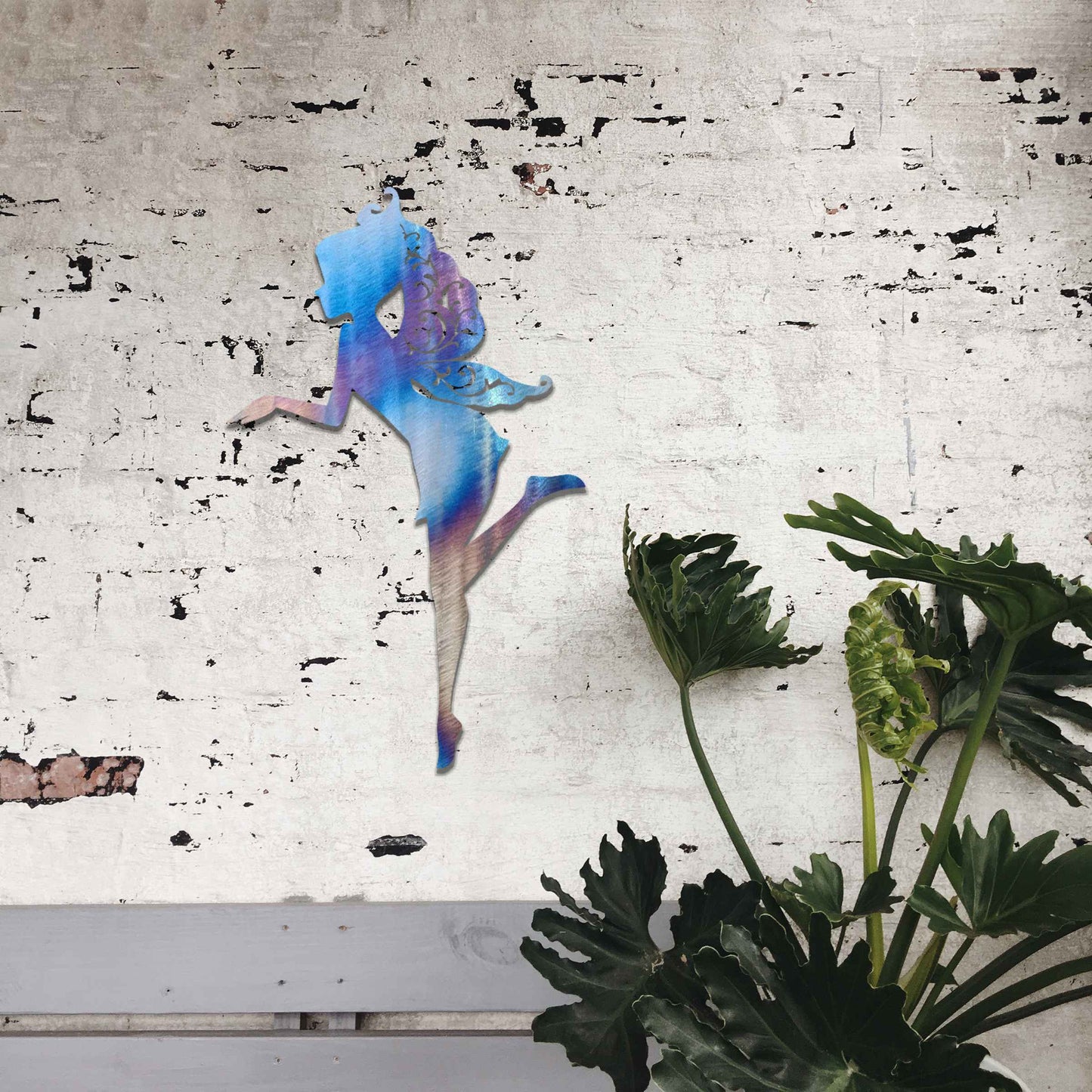 Thank you for the clarification! The design features a silhouette of a fairy in a graceful pose, with flowing hair and wings. The fairy is captured in mid-motion, bringing a sense of whimsy and elegance to the artwork.