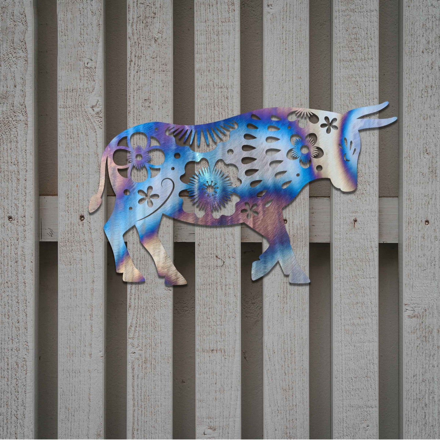 The design showcases a bull adorned with intricate floral patterns, blending natural strength with delicate details. The bold shape of the bull is enhanced by the flower motifs, giving it a unique and artistic appearance.