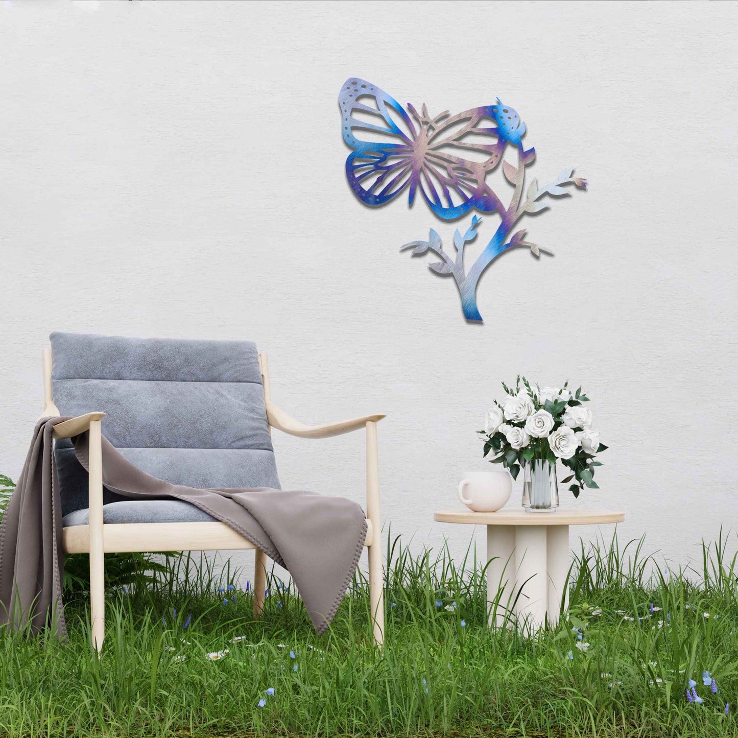 Metal garden decoration featuring a butterfly resting on a leafy branch, crafted with intricate detailing to bring a touch of nature-inspired elegance and charm to outdoor walls or garden settings.