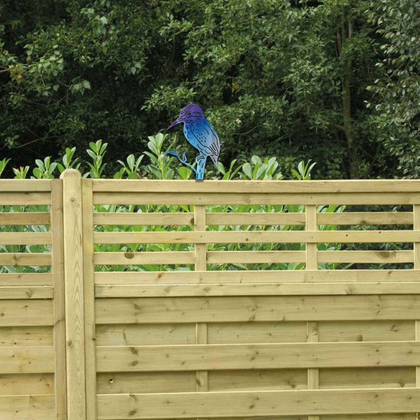 Metal garden decoration featuring a kingfisher silhouette perched on a branch, crafted with a rustic finish, designed to sit atop fences or garden posts, adding a natural and artistic accent to outdoor spaces.