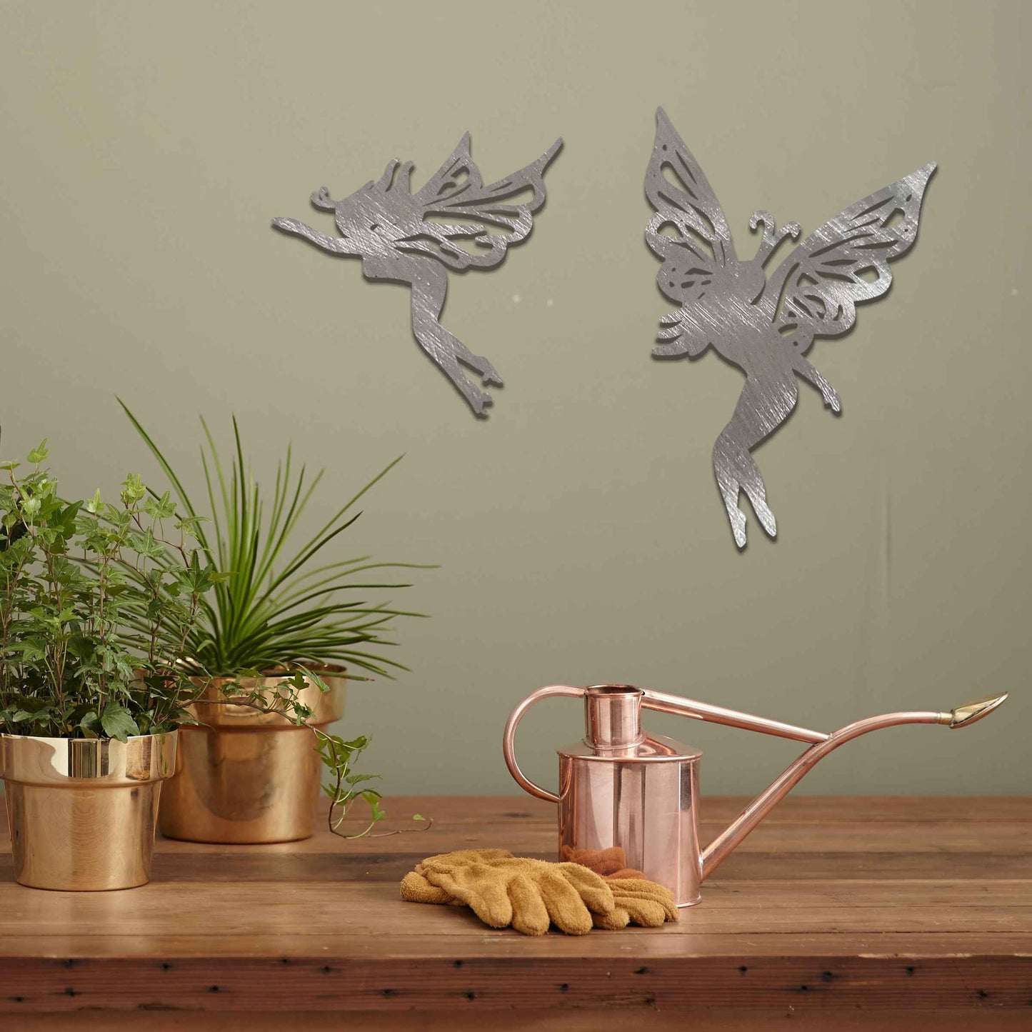 The image depicts two graceful fairies with intricate wings, suspended in mid-air. Their delicate, elegant figures evoke a sense of lightness and magic, adding a whimsical touch to any space, perfect for creating an enchanting atmosphere.