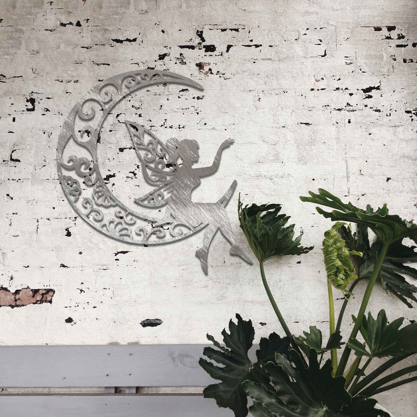 This artwork features a fairy gracefully seated on a crescent moon, her wings adorned with swirling floral patterns. The design captures a sense of peace and serenity, with the intricate details enhancing the enchanting nature of the scene.