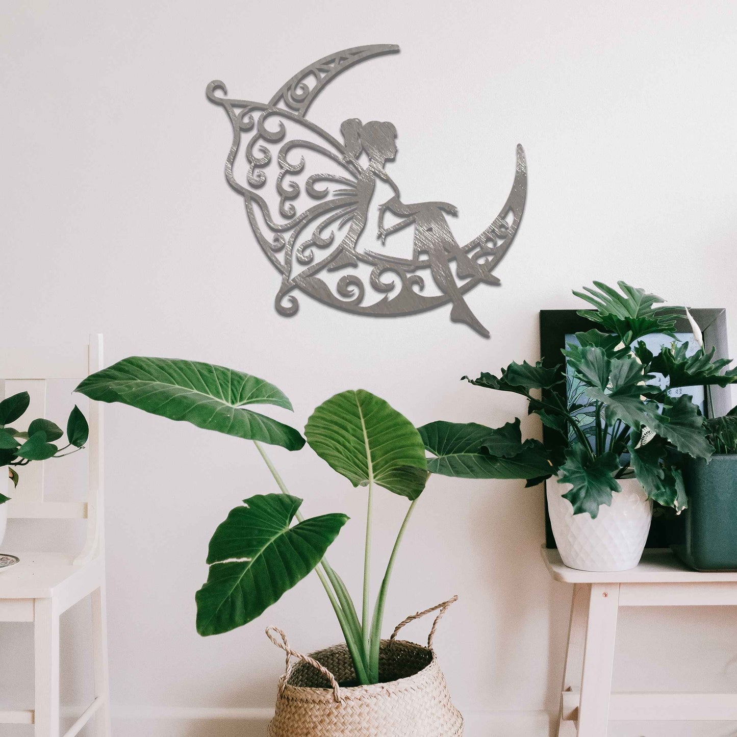 This design shows a fairy sitting on a crescent moon, with elegantly detailed, swirling patterns adorning both the moon and her wings. The graceful pose of the fairy and the intricate designs create a dreamy and whimsical atmosphere, perfect for adding a touch of magic to any space.