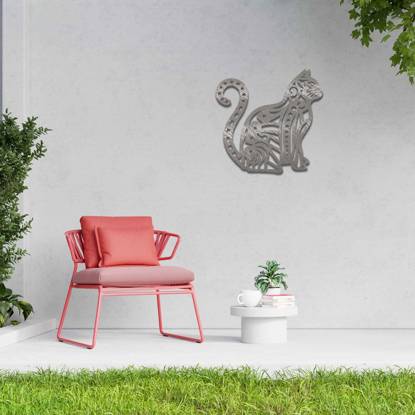 Metal garden decoration featuring a sitting cat with an intricate geometric and swirl pattern, adding a playful and artistic touch to outdoor walls or garden settings.