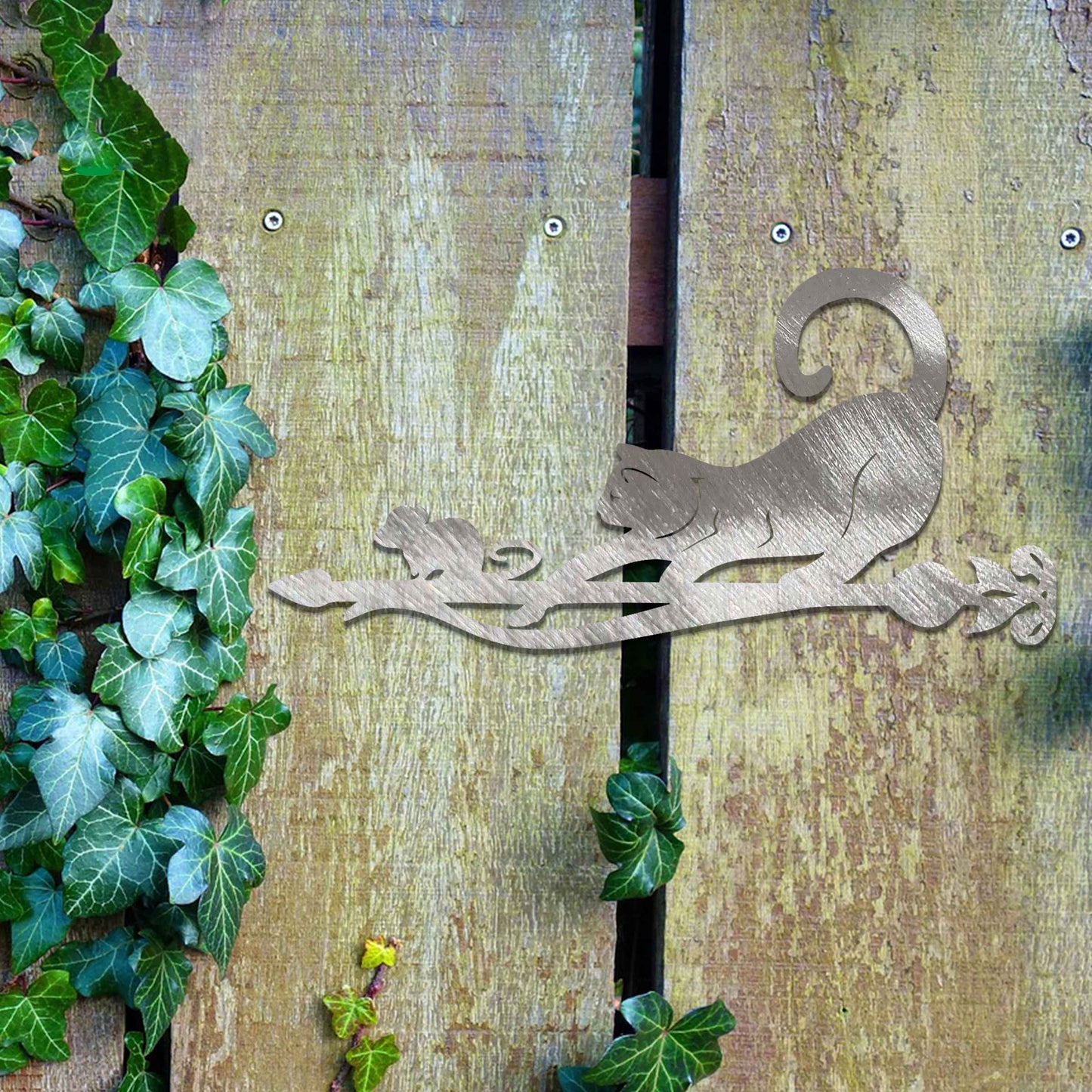 Metal garden decoration featuring a playful cat and mouse silhouette on a decorative branch, crafted with intricate details and a rustic finish, adding a whimsical and charming touch to outdoor spaces.