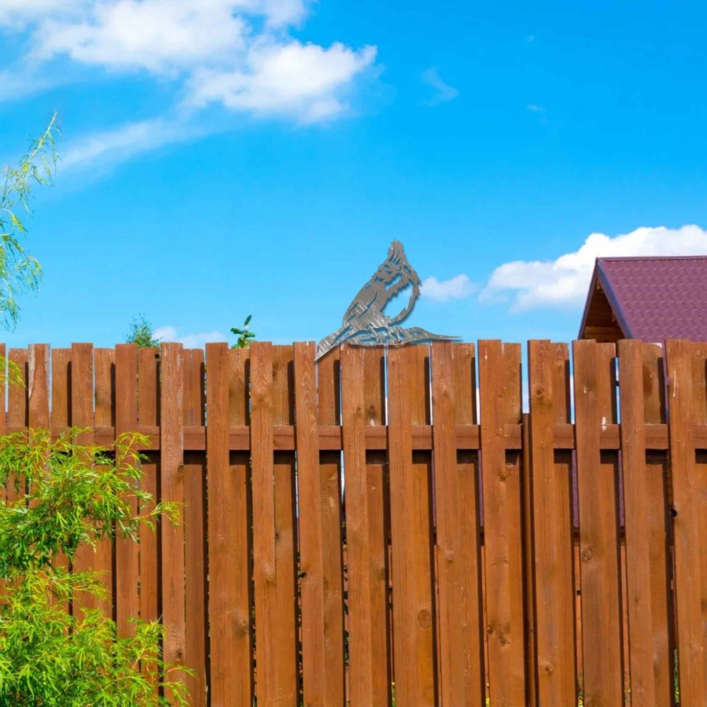 Metal garden decoration featuring a hoopoe bird silhouette with intricate cutout details and a rustic finish, designed to sit atop fences or posts, adding a distinctive and elegant touch to outdoor spaces.