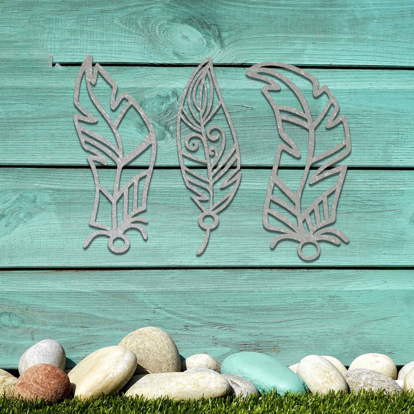 This design features three elegantly styled feathers, each with intricate patterns. The flowing lines and curved shapes give a sense of movement, making the artwork a beautiful representation of nature's delicate beauty.