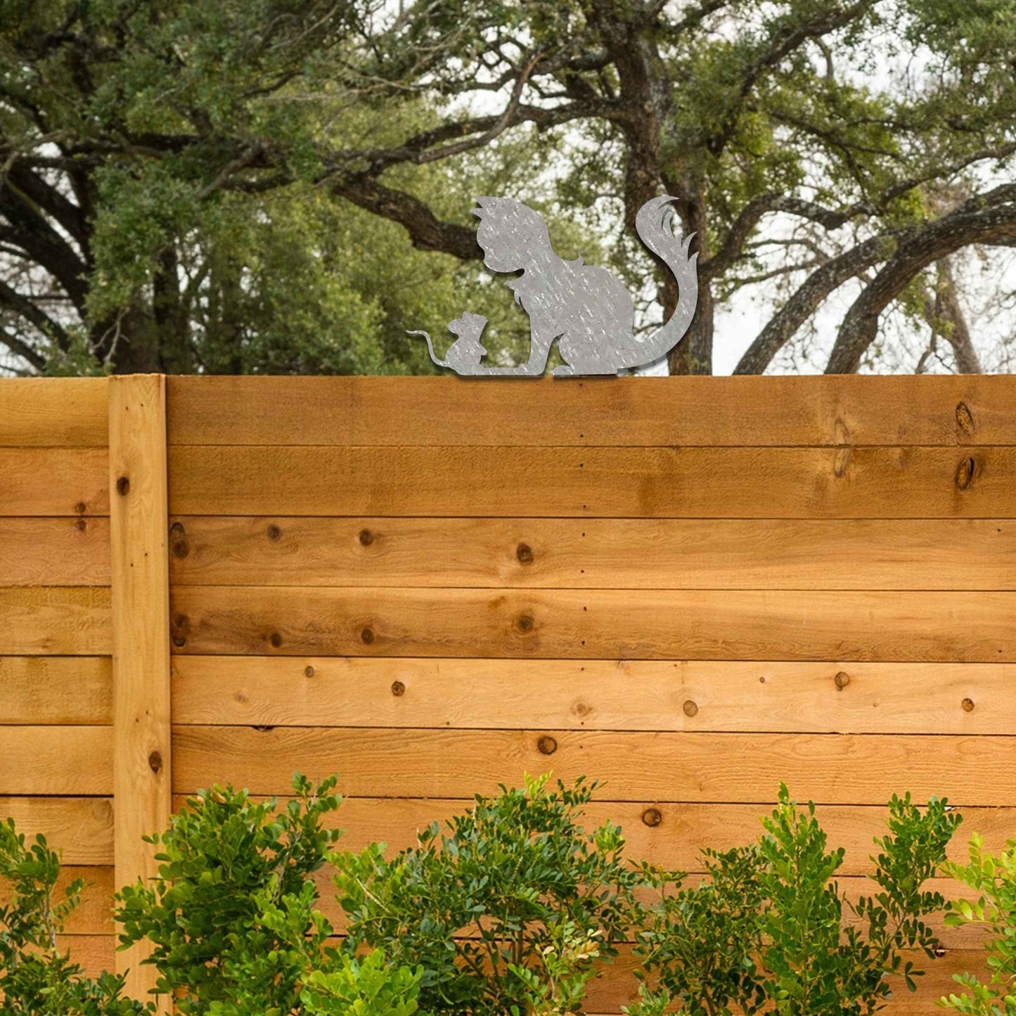 Metal garden decoration featuring a silhouette of a cat and mouse in a playful pose, adding a whimsical and rustic charm to outdoor spaces, perfectly suited for fence tops or garden walls.