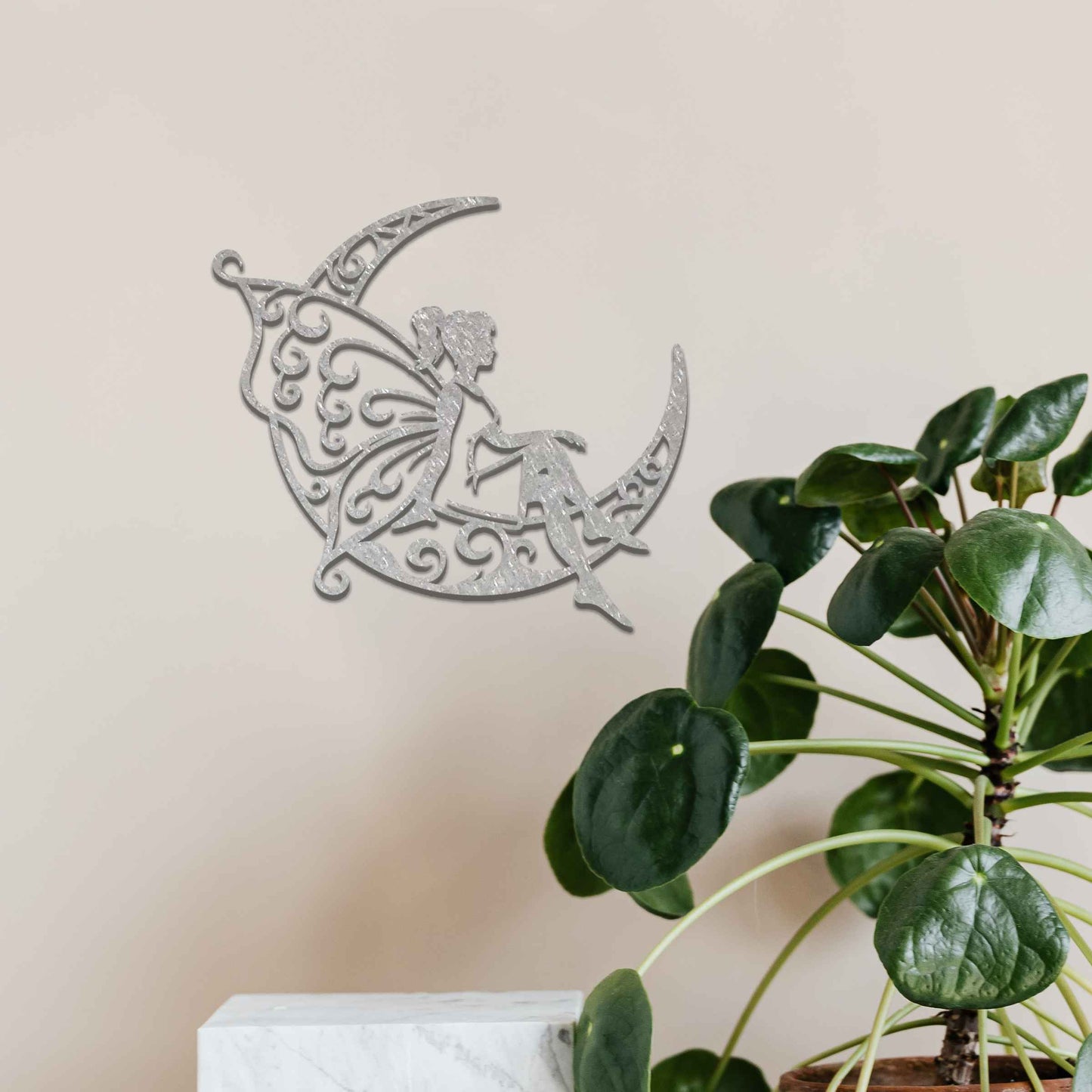 This design shows a fairy sitting on a crescent moon, with elegantly detailed, swirling patterns adorning both the moon and her wings. The graceful pose of the fairy and the intricate designs create a dreamy and whimsical atmosphere, perfect for adding a touch of magic to any space.